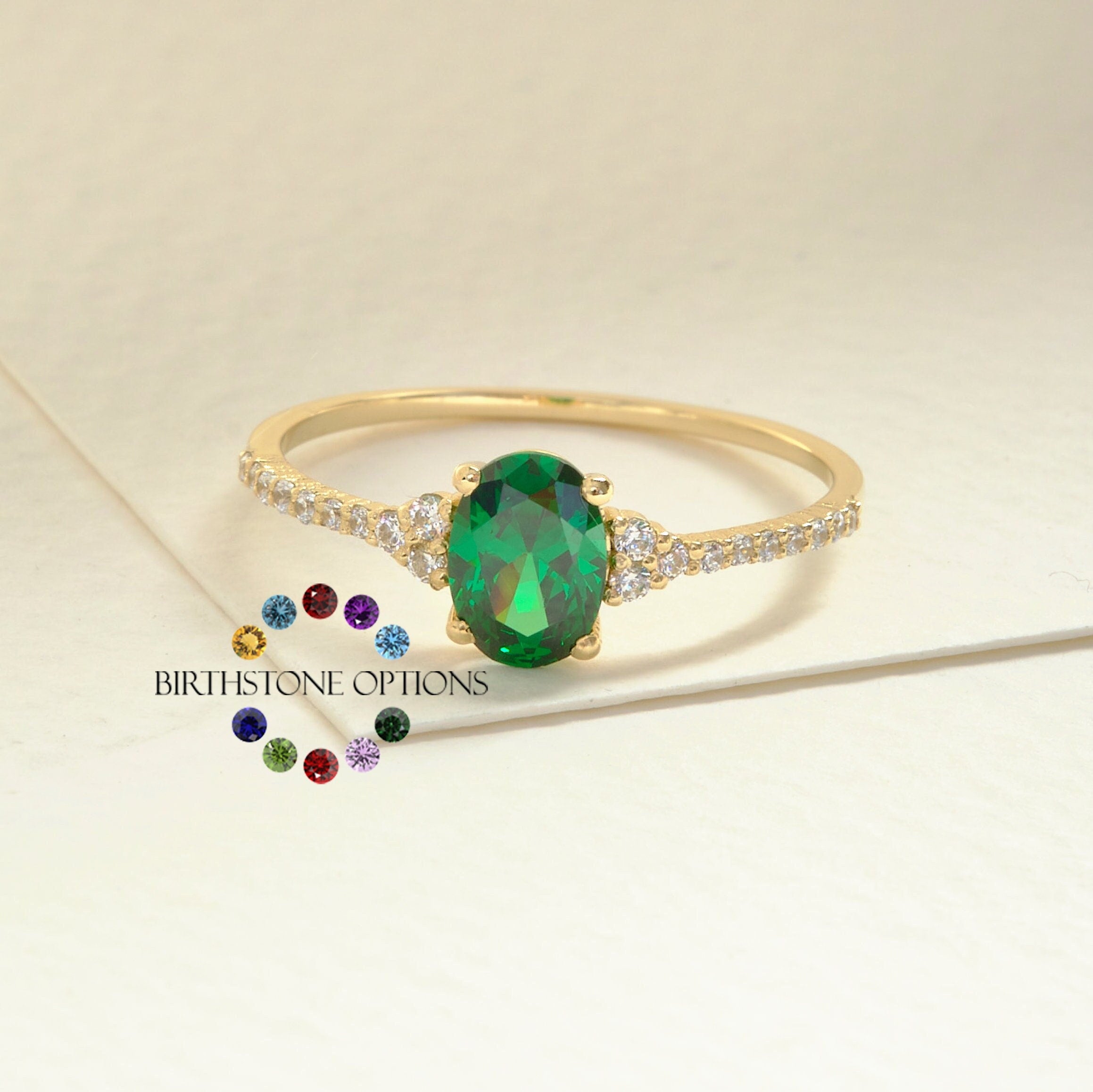 Oval Emerald Engagement Ring – 14K Solid Gold with Side Diamonds 💚✨
Refined, radiant, and meaningful — this Oval Emerald Engagement Ring brings together timeless elegance and modern sparkle. The deep green emerald at its center symbolizes love and renewal, while the shimmering side moissanites add a touch of brilliance for a truly captivating finish.