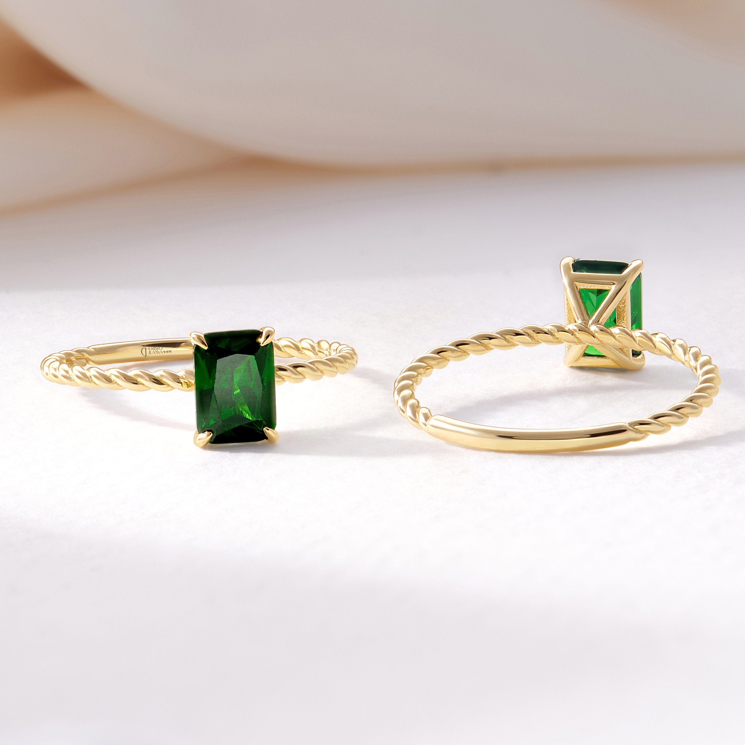 Emerald Cut Emerald Ring – 14K Solid Gold Twisted Rope Band 💚✨
This emerald cut emerald ring blends timeless sophistication with artisanal design. The deep green rectangular gemstone is beautifully framed by a twisted rope band, handcrafted in solid 14K gold for a touch of vintage luxury. Whether worn solo or stacked, it’s a graceful statement of renewal, elegance, and individuality — perfect as a birthstone, anniversary, or Christmas gift.