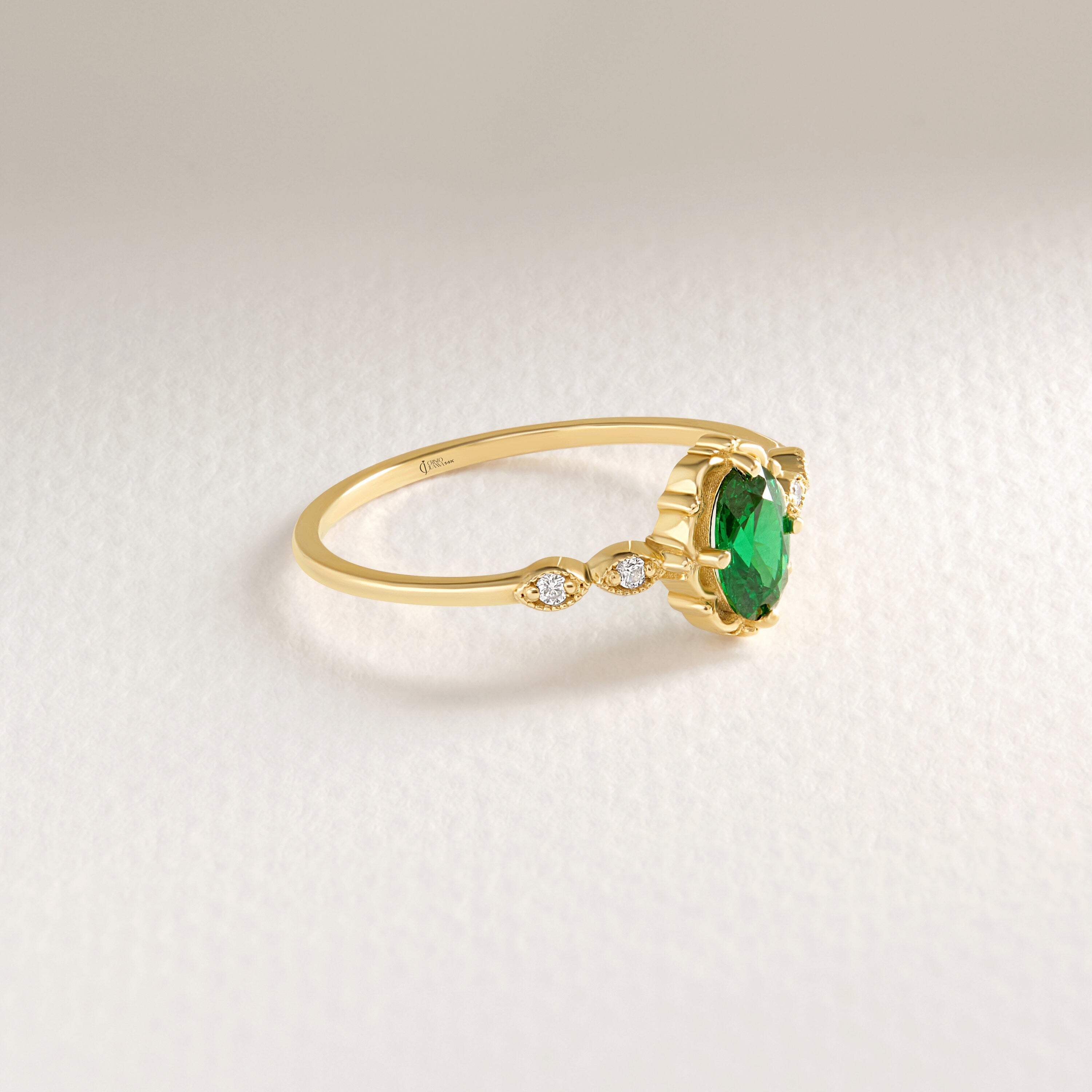 We combined oval emerald engagement ring with 14K solid gold small side diamond and created emerald diamond ring! This art deco emerald green wedding ring with tiny diamond can be customize with her birthstone! Are you looking for emerald ring gold and may birthstone ring. Here is emerald promise ring and oval emerald ring for yourself. Discover our thinking of you ring and 14K birthstone ring as a cristojuanna emerald gift.