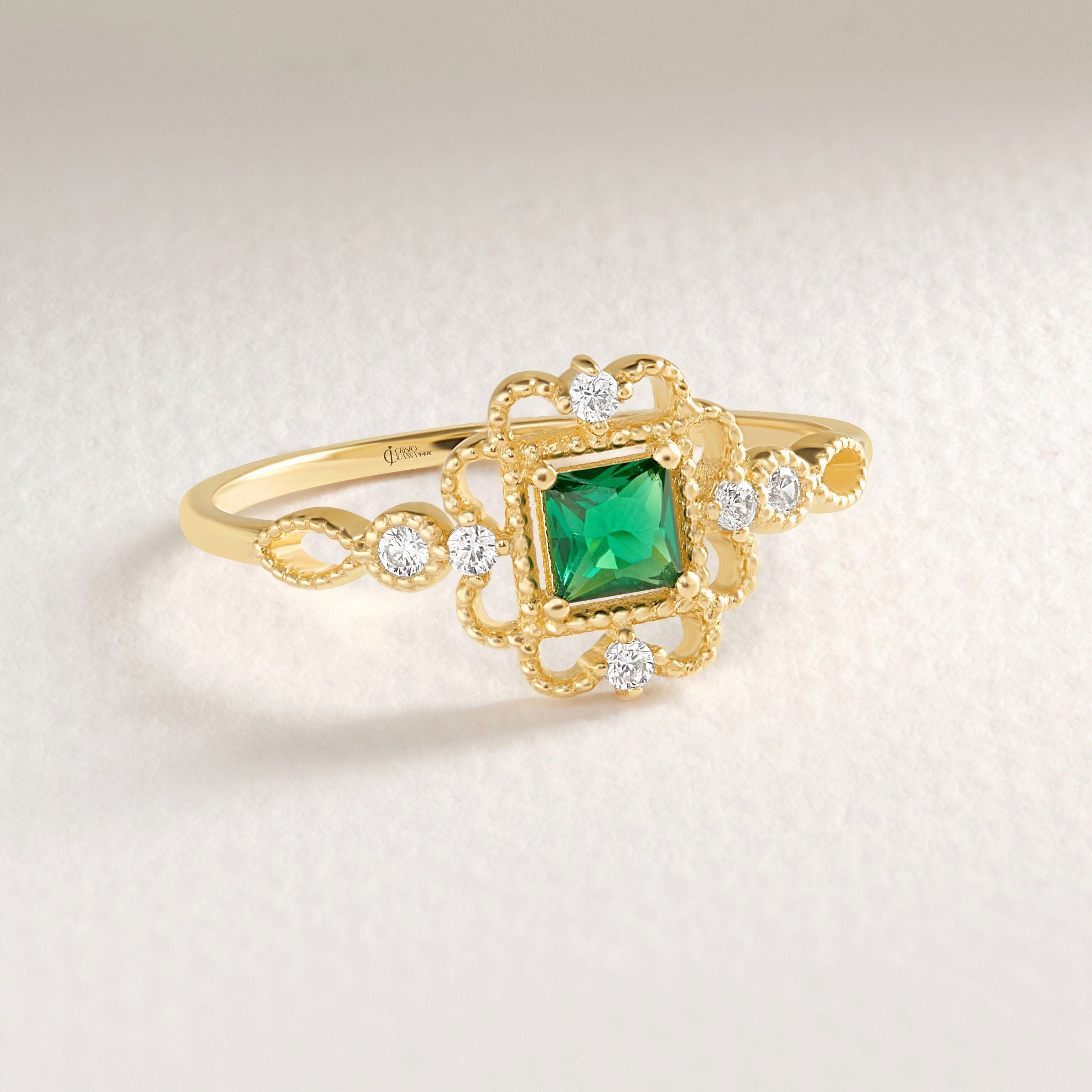 Princess Cut Emerald Engagement Ring – 10K / 14K / 18K Solid Gold 💚✨
A vibrant princess-cut emerald set in a delicate band accented with sparkling round diamonds. Its square silhouette and art deco charm make it a timeless engagement, promise, or birthstone ring. A perfect gift for emerald lovers and vintage jewelry enthusiasts.