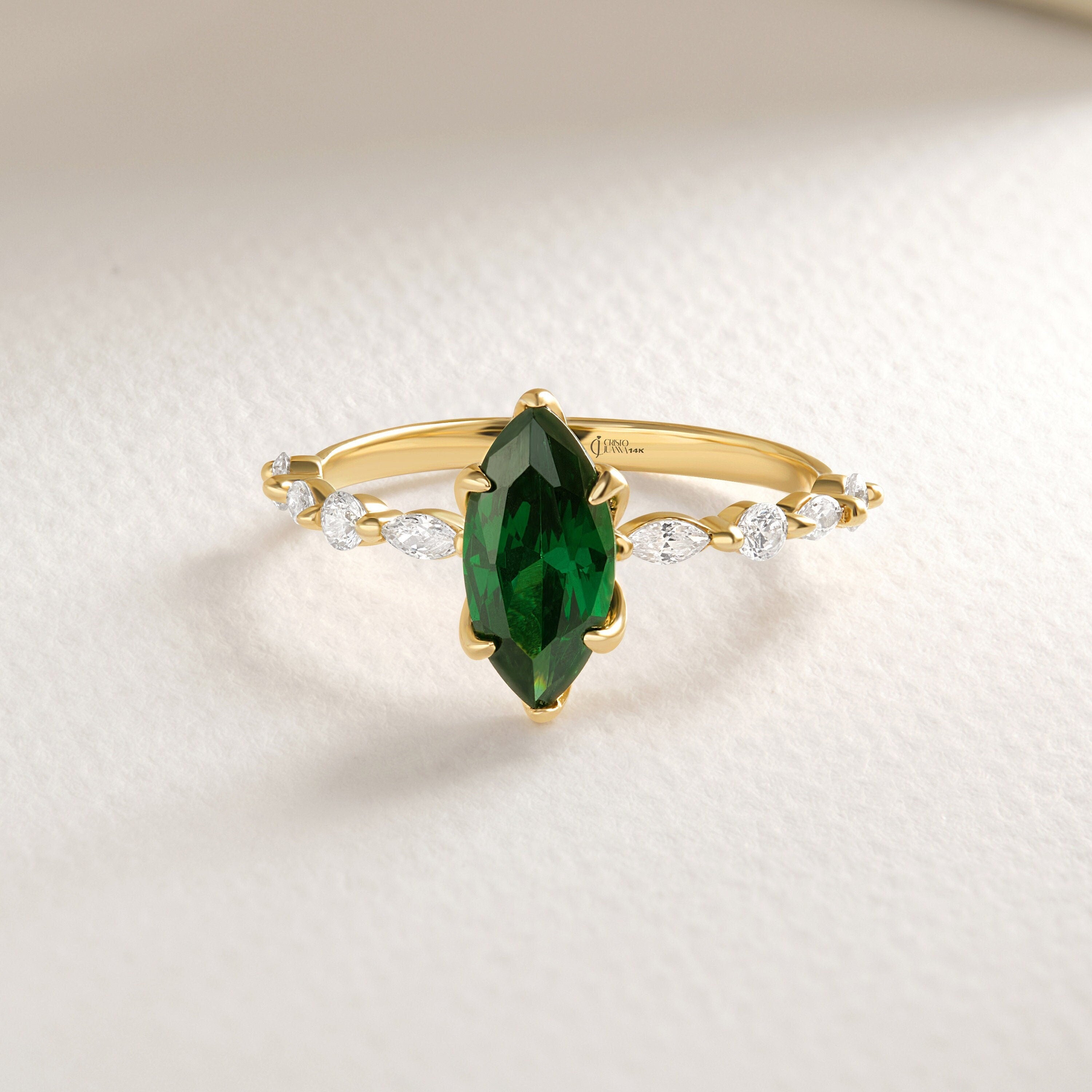 ๐ Marquise Emerald Engagement Ring โ 14K Solid Gold Side Diamond Band ๐
Make her heart sparkle with this marquise-cut emerald engagement ring, featuring a vivid green gemstone at its center and dazzling round-cut side diamonds for extra brilliance. This piece combines timeless elegance with a touch of modern artistry โ perfect for engagements, anniversaries, or meaningful gifts.