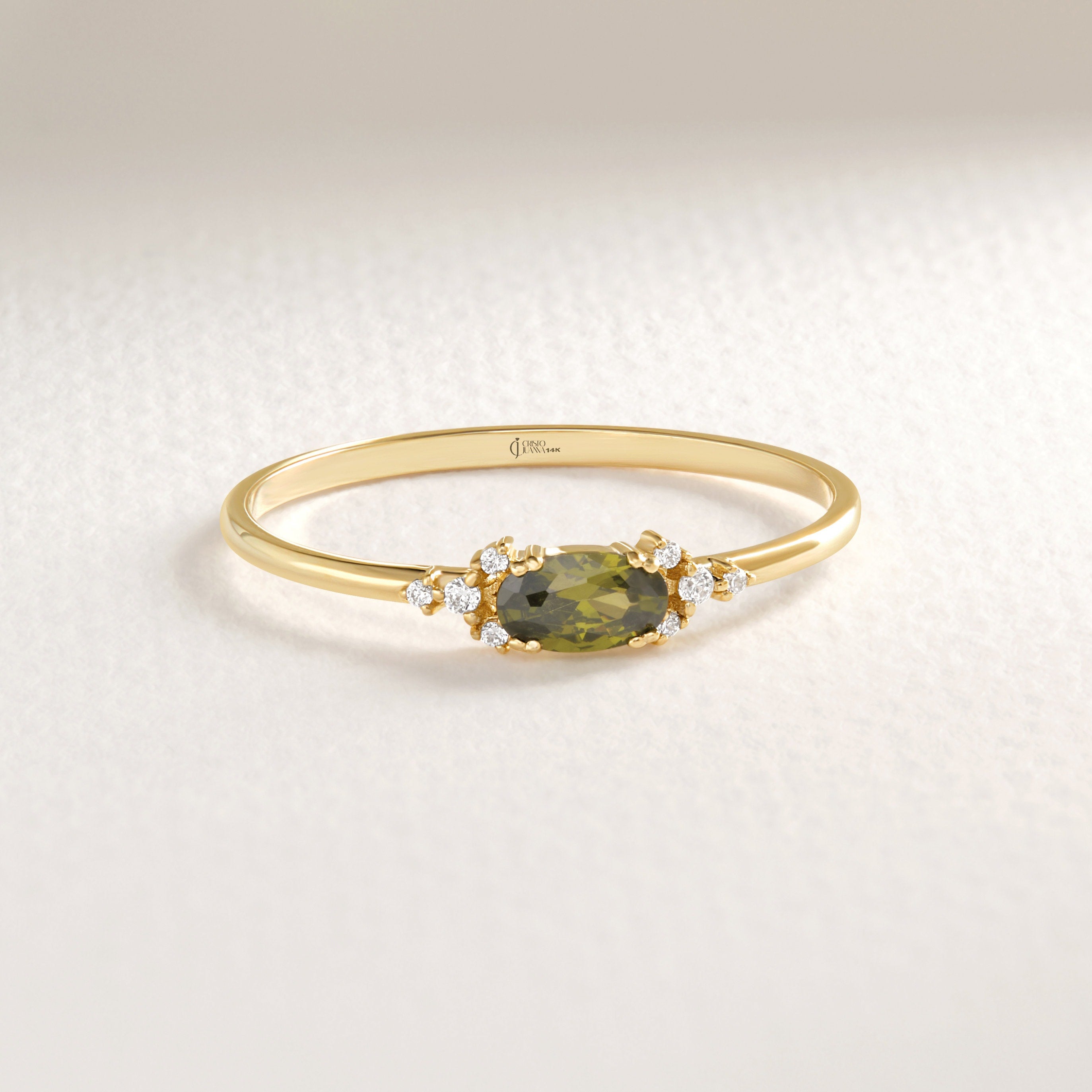 14K Gold Peridot Diamond Ring – Dainty Oval Birthstone Stacking Band 💚✨
Celebrate elegance and meaning with this handcrafted gold peridot ring, featuring a vibrant natural oval peridot and sparkling diamond or moissanite accents. Designed to be worn solo or as part of a dainty stacking ring set, this gemstone band radiates warmth, light, and timeless charm.