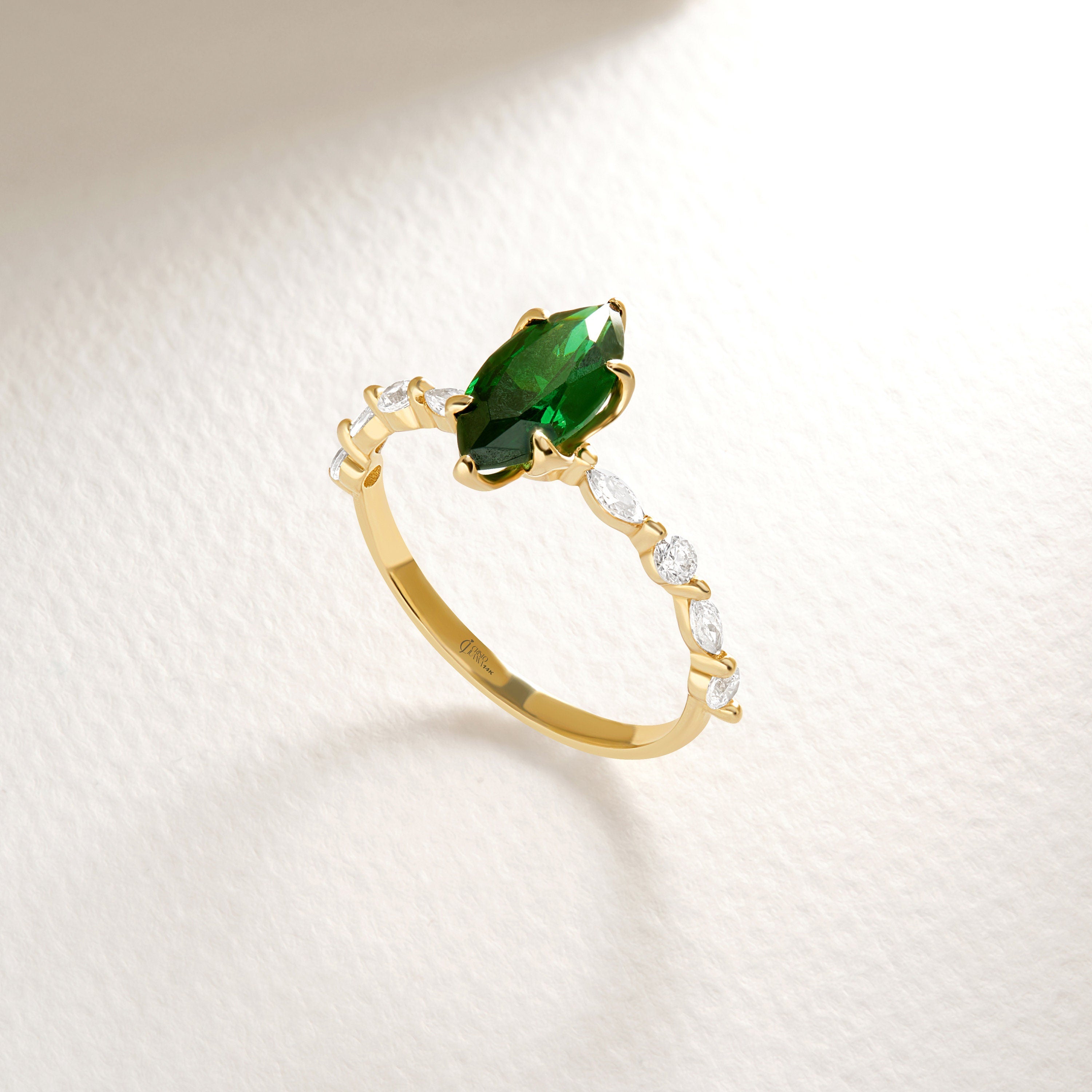 ๐ Marquise Emerald Engagement Ring โ 14K Solid Gold Side Diamond Band ๐
Make her heart sparkle with this marquise-cut emerald engagement ring, featuring a vivid green gemstone at its center and dazzling round-cut side diamonds for extra brilliance. This piece combines timeless elegance with a touch of modern artistry โ perfect for engagements, anniversaries, or meaningful gifts.
