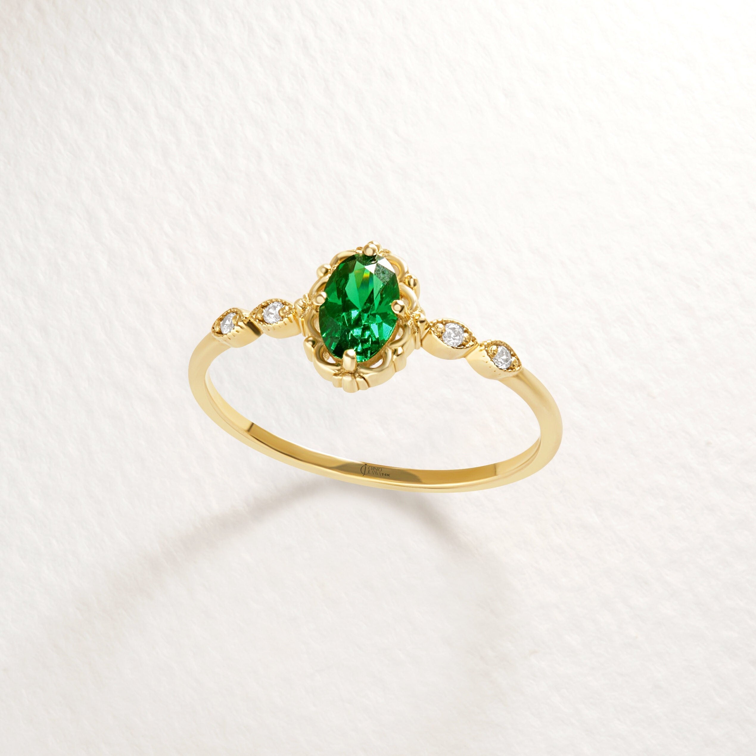 We combined oval emerald engagement ring with 14K solid gold small side diamond and created emerald diamond ring! This art deco emerald green wedding ring with tiny diamond can be customize with her birthstone! Are you looking for emerald ring gold and may birthstone ring. Here is emerald promise ring and oval emerald ring for yourself. Discover our thinking of you ring and 14K birthstone ring as a cristojuanna emerald gift.