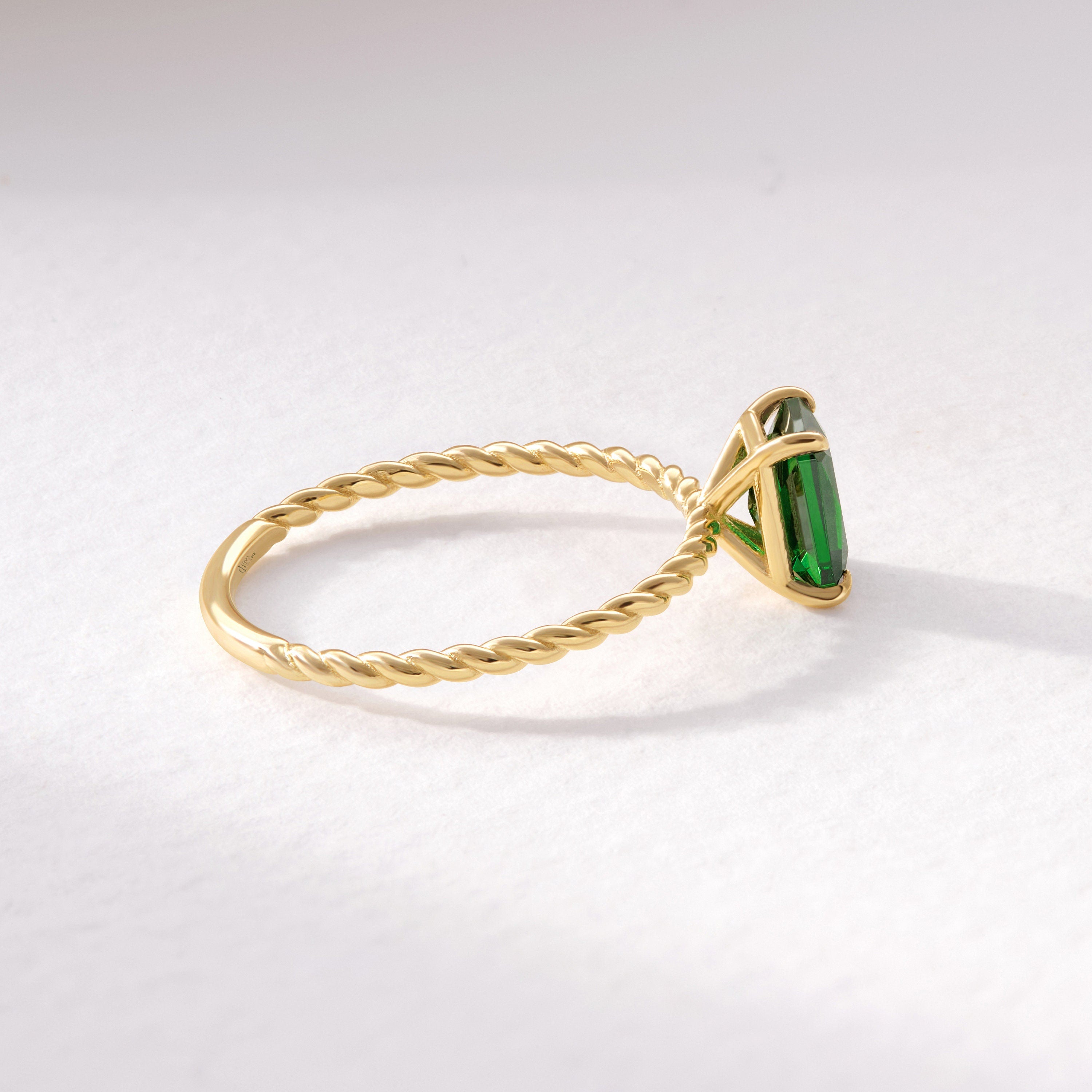 Emerald Cut Emerald Ring – 14K Solid Gold Twisted Rope Band 💚✨
This emerald cut emerald ring blends timeless sophistication with artisanal design. The deep green rectangular gemstone is beautifully framed by a twisted rope band, handcrafted in solid 14K gold for a touch of vintage luxury. Whether worn solo or stacked, it’s a graceful statement of renewal, elegance, and individuality — perfect as a birthstone, anniversary, or Christmas gift.