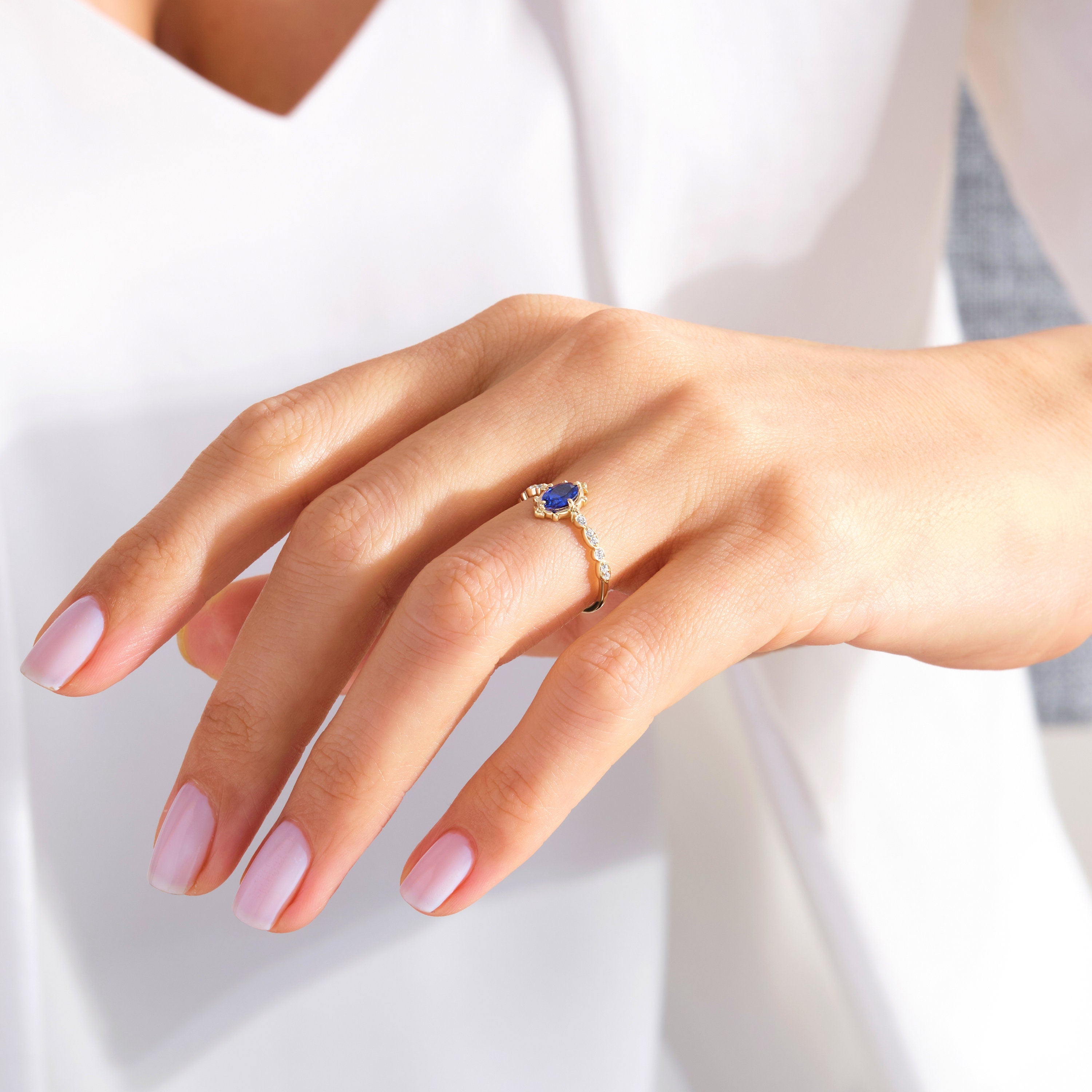 Oval Sapphire Engagement Ring – 10K / 14K / 18K Solid Gold 💙✨
This stunning oval sapphire ring sparkles with round-cut side diamonds, creating a timeless engagement or promise ring. A vintage-inspired design that combines elegance and symbolism, making it a perfect heirloom piece.