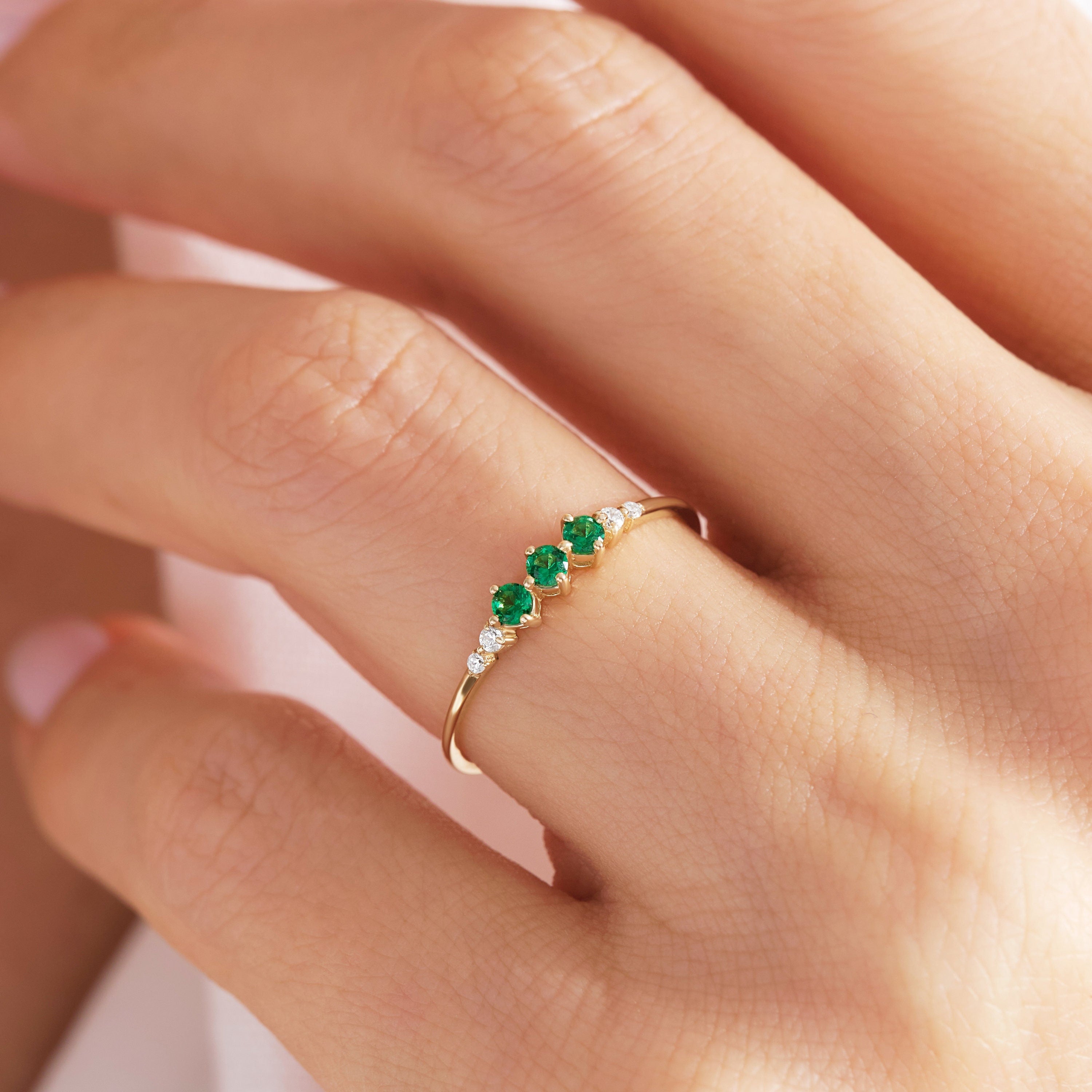 Round Emerald & Diamond Three-Stone Ring – 14K Solid Gold 💚💎
Elegant, symbolic, and full of meaning — this three-stone emerald ring represents love, balance, and renewal. Featuring three vivid round-cut emeralds accented by two sparkling side diamonds, it’s a modern heirloom designed for everyday sophistication or milestone celebrations.