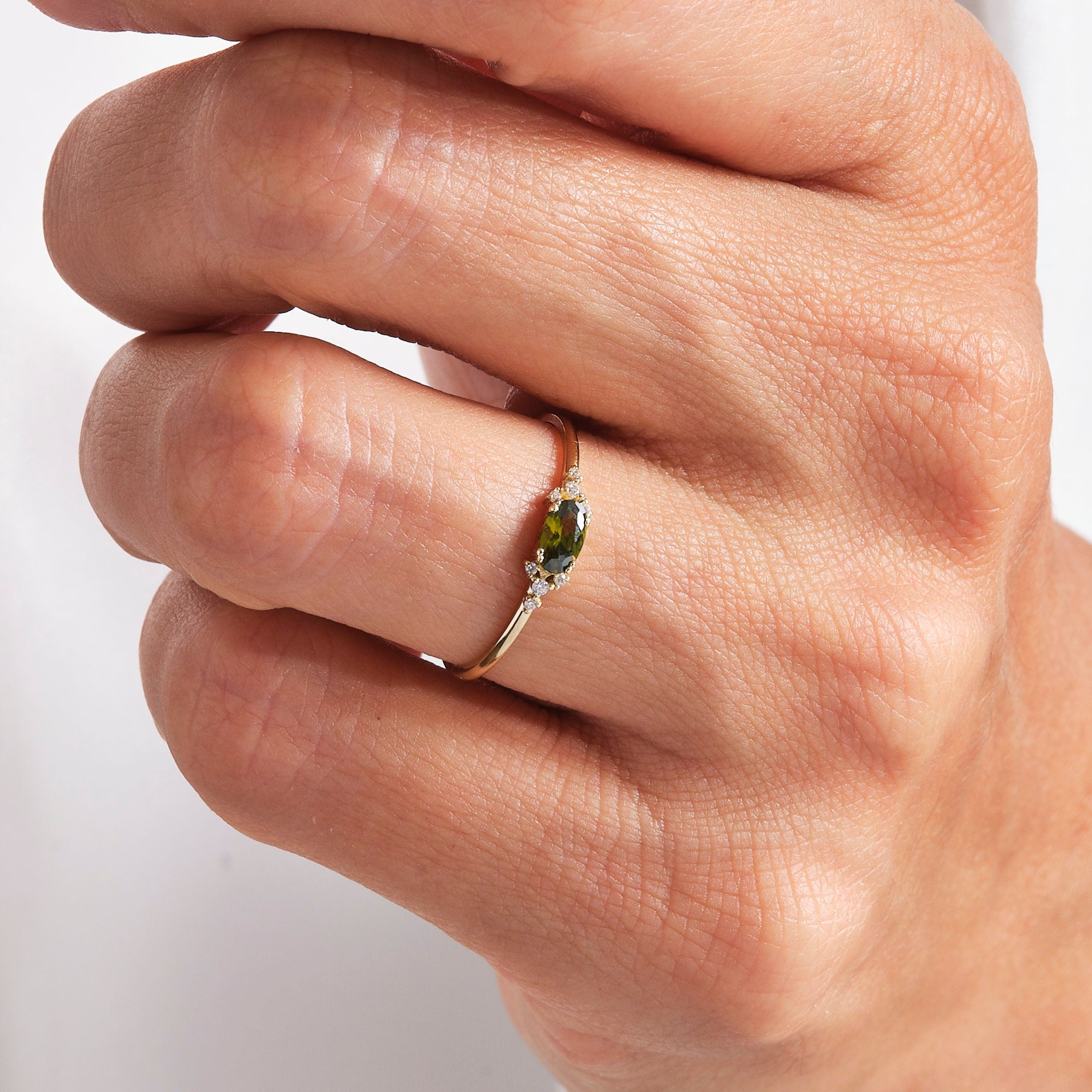 14K Gold Peridot Diamond Ring – Dainty Oval Birthstone Stacking Band 💚✨
Celebrate elegance and meaning with this handcrafted gold peridot ring, featuring a vibrant natural oval peridot and sparkling diamond or moissanite accents. Designed to be worn solo or as part of a dainty stacking ring set, this gemstone band radiates warmth, light, and timeless charm.