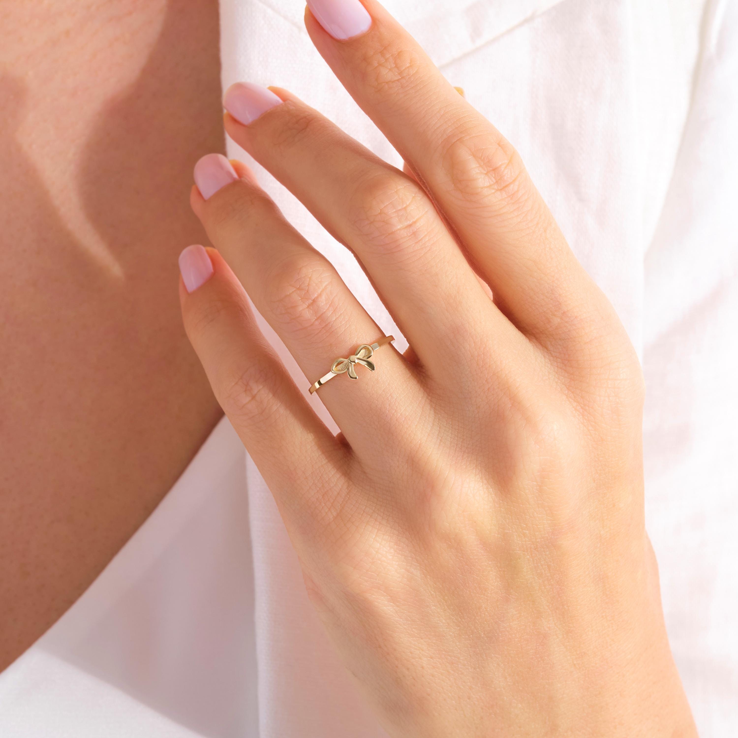 Ribbon Bow 14K Solid Gold Ring – Dainty Bowtie Stacking Ring for Women 🎀✨
Sweet, feminine, and full of charm — this Ribbon Bow Ring is the perfect symbol of elegance and connection. Handcrafted from solid 14K gold, the delicate bowknot design makes it a timeless choice for stacking, gifting, or celebrating your closest bonds.