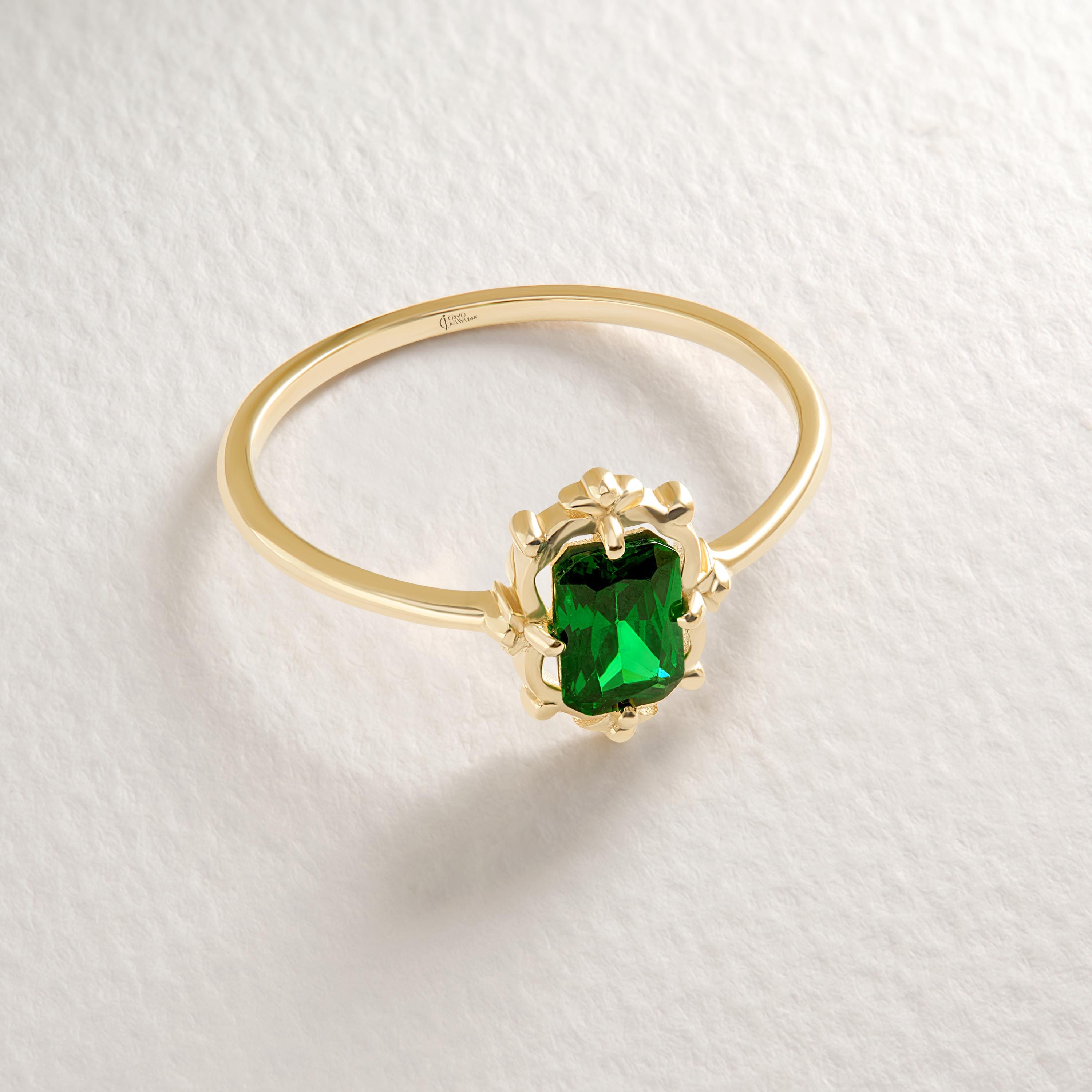 💚 Emerald Cut Emerald Engagement Ring – 14K Solid Gold 💚
Timeless and captivating, this Emerald Cut Emerald Engagement Ring combines vintage Art Deco elegance with modern craftsmanship. The striking green gemstone sits in a sleek rectangular setting, making it a perfect choice for engagements, anniversaries, or a meaningful everyday statement.