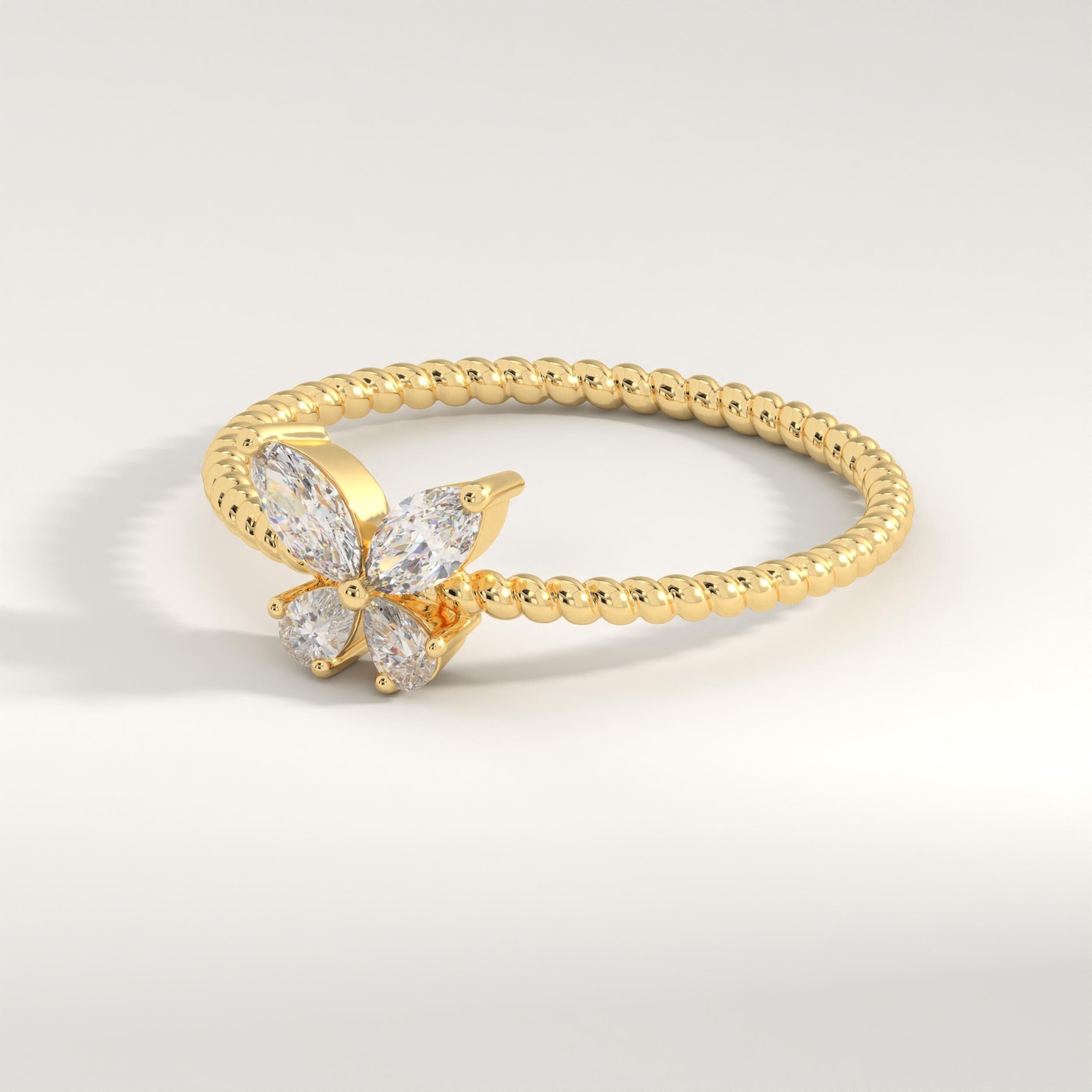 Marquise Diamond Butterfly Ring – 14K Solid Gold ✨💎
This stunning butterfly-inspired diamond ring features marquise and pear-cut stones forming delicate wings atop a braided gold band. A perfect mix of nature’s grace and timeless beauty — ideal for brides, bridesmaids, or anyone who loves elegant sparkle. 🦋💍