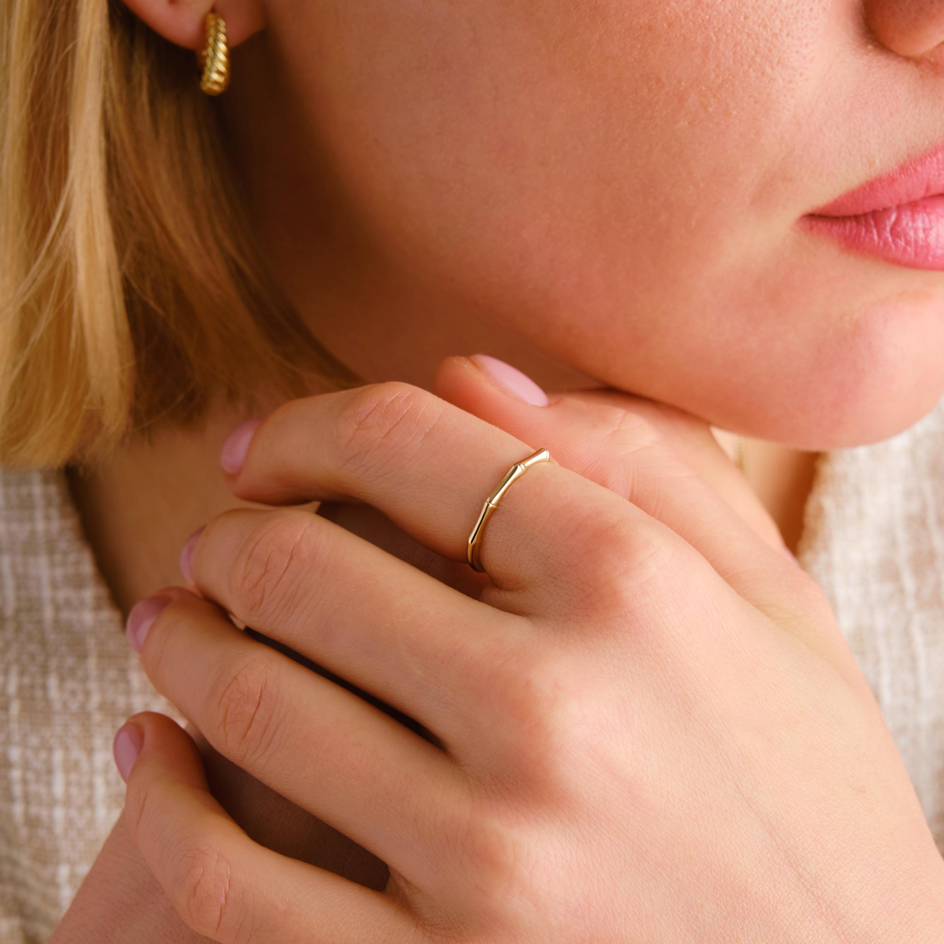Elegant and nature-inspired bamboo ring gold 14K design, perfect for stacking or gifting. This gold stackable ring features a delicate texture, making it a stylish dainty boho ring 10K option. A true designer bamboo ring ideal as a summer jewelry gift or thoughtful ring gift for her. Choose a custom engraved ring for a unique touch. Our bamboo band ring 18K is a handcraft ring gold piece made with care. A meaningful personalized present for her as a birthday or her promise ring.