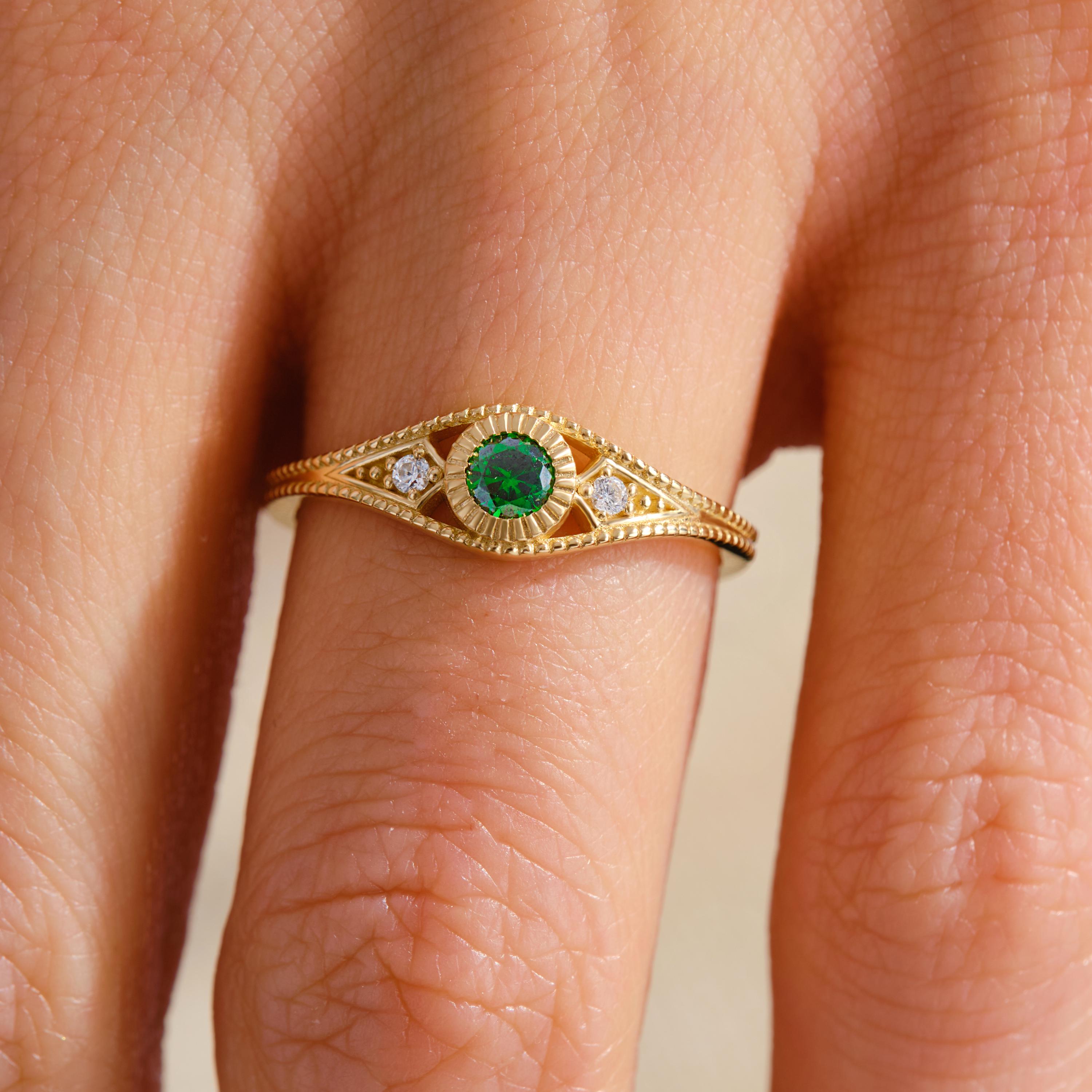Timeless in form and refined in detail, this emerald wedding ring is elevated by side diamond rings and a sculptural split shank ring 14k silhouette. Designed as a personalized present with birthstone artdeco inspiration, it bridges elegance and emotion. From emerald engagement to vintage braided band, every element speaks intention.