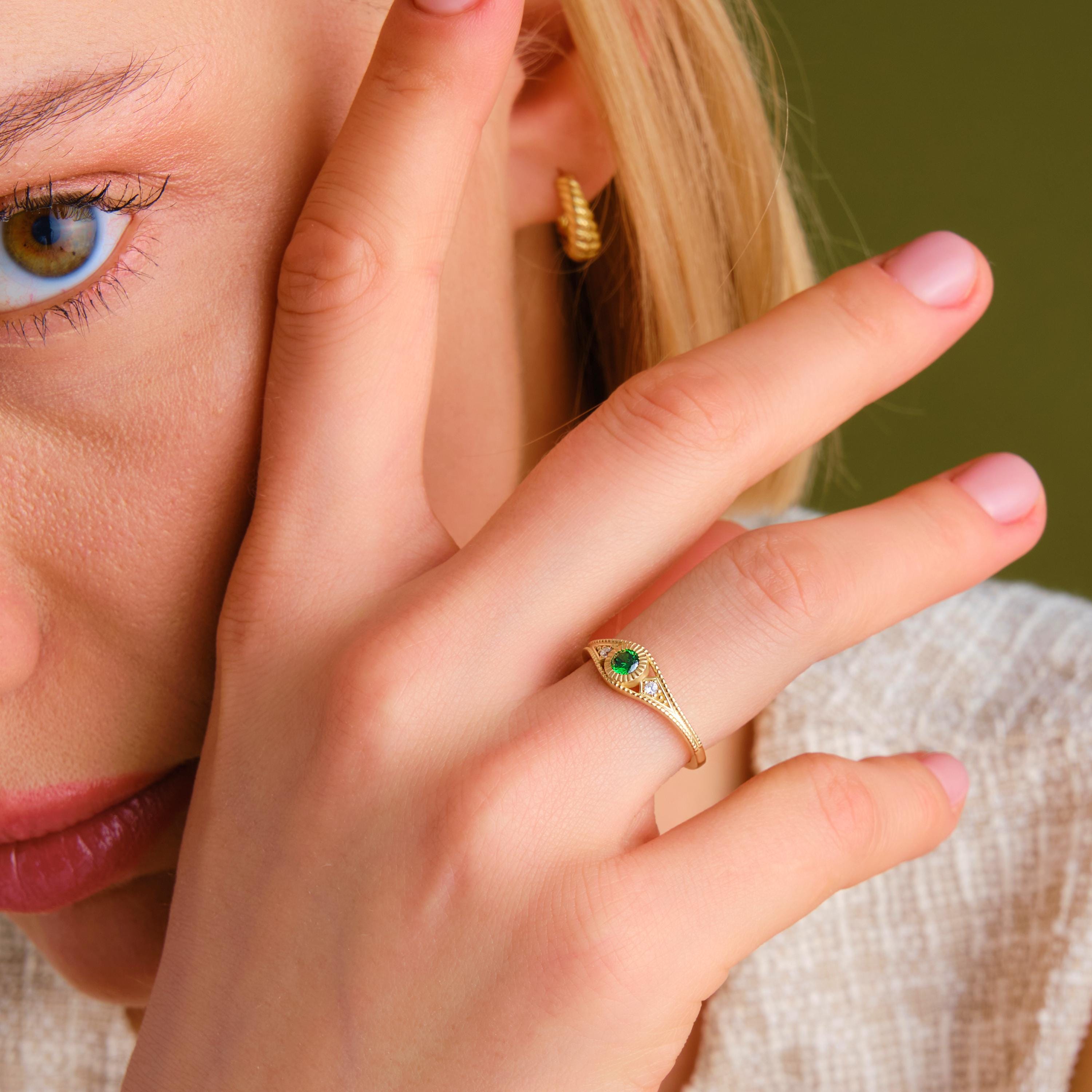 Timeless in form and refined in detail, this emerald wedding ring is elevated by side diamond rings and a sculptural split shank ring 14k silhouette. Designed as a personalized present with birthstone artdeco inspiration, it bridges elegance and emotion. From emerald engagement to vintage braided band, every element speaks intention.