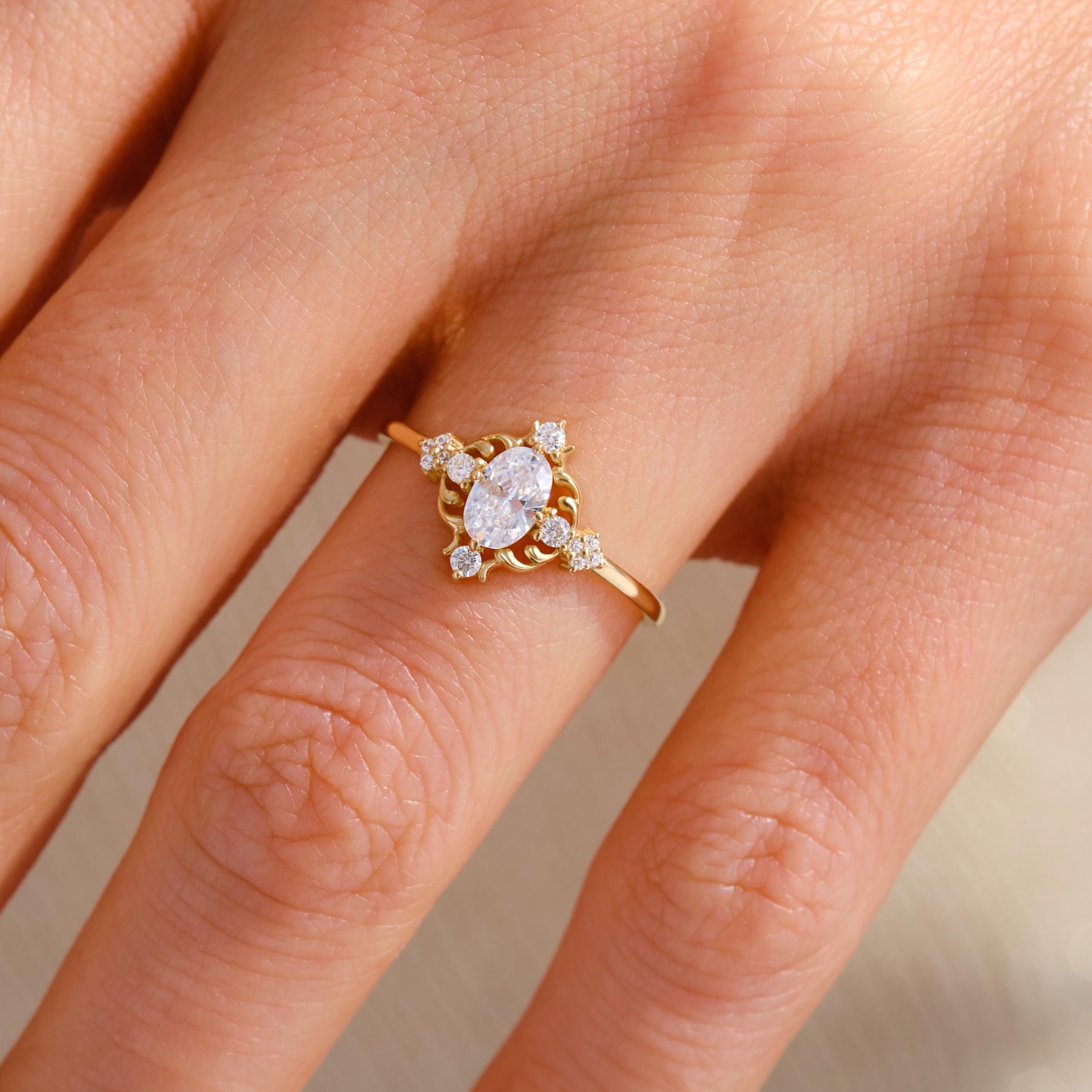 Oval Diamond Engagement Ring – 10K / 14K / 18K Solid Gold ✨💍
A timeless piece that blends vintage charm with modern elegance. Featuring a sparkling 6x4 mm oval-cut diamond (or moissanite) surrounded by delicate side stones, this ring makes a stunning choice for engagements, anniversaries, or milestone moments. 💎