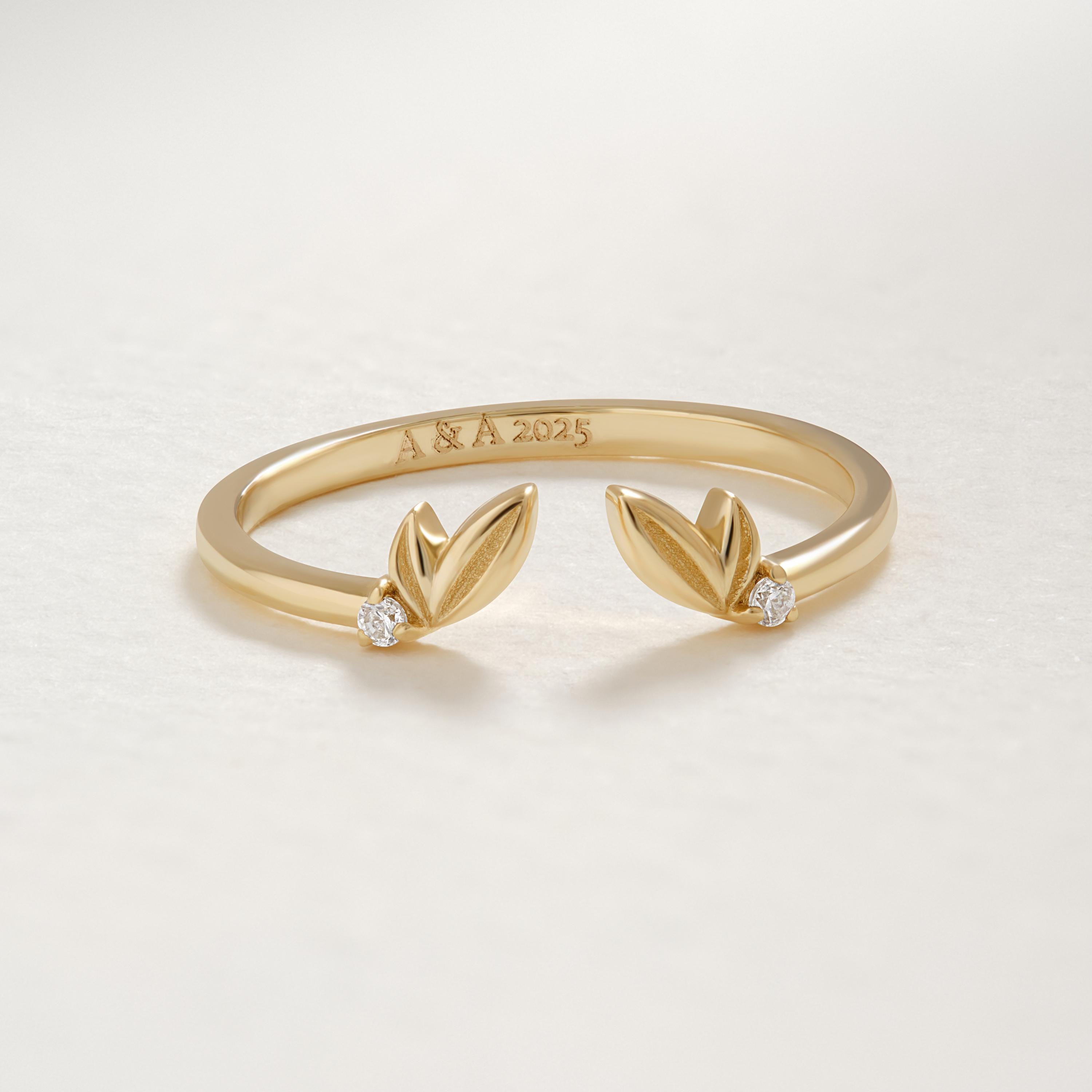 Open Leaf Engagement Ring – 10K/14K/18K Solid Gold ✨💎
Inspired by nature, this delicate open leaf engagement ring features two sparkling round diamonds or moissanites set on an adjustable ivy-style band. Perfect for nature lovers, brides seeking a unique floral touch, or anyone who loves dainty, whimsical jewelry.