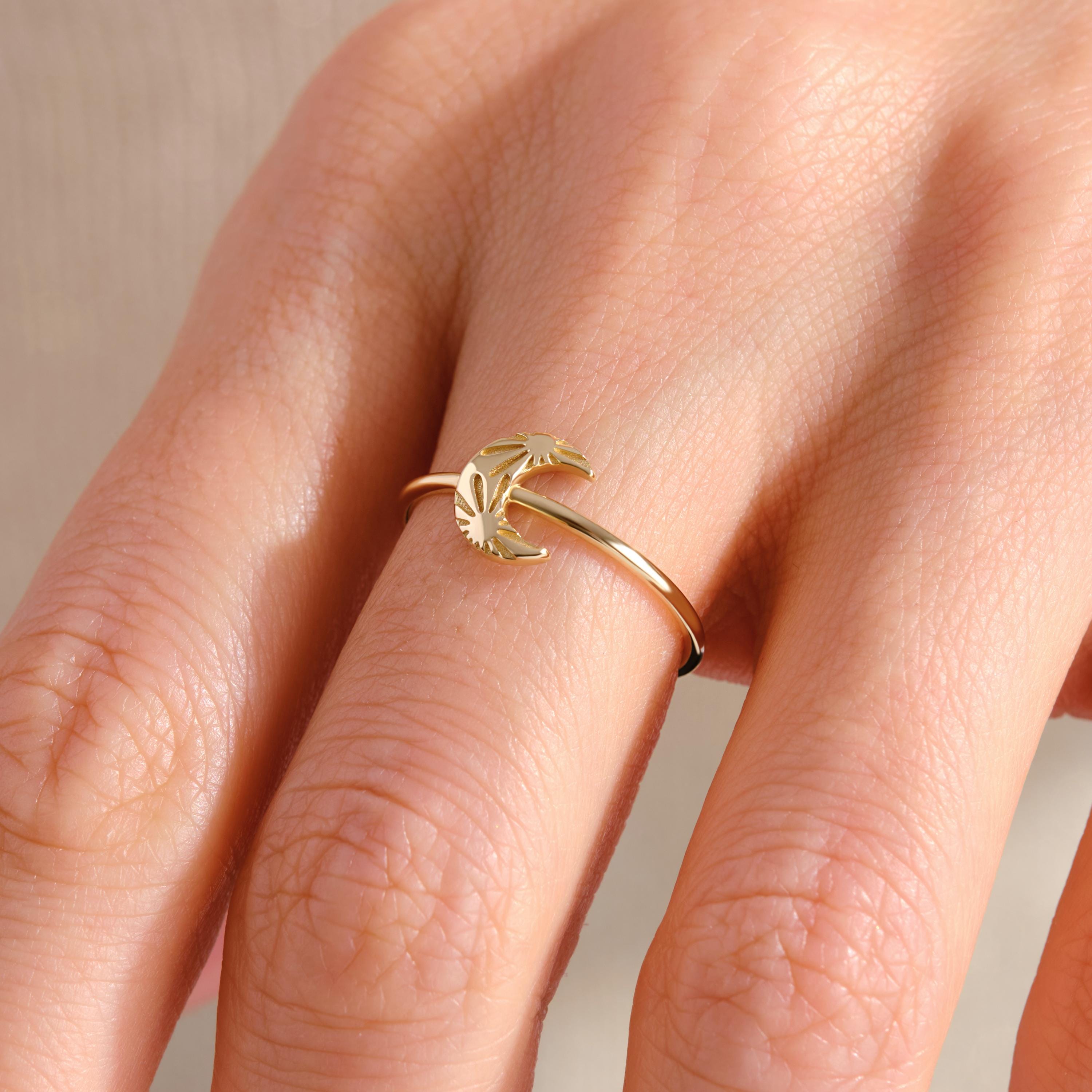 Crescent Moon Ring – 14K Solid Gold 🌙☀️
This delicate crescent moon ring features a moon and sun texture design, symbolizing balance, harmony, and the connection between day and night. Its minimalist style makes it perfect for everyday wear, stacking with other rings, or gifting to someone special who loves celestial jewelry.
The slim gold band is comfortable, timeless, and available in yellow, white, or rose gold — making it a versatile piece for any jewelry collection.