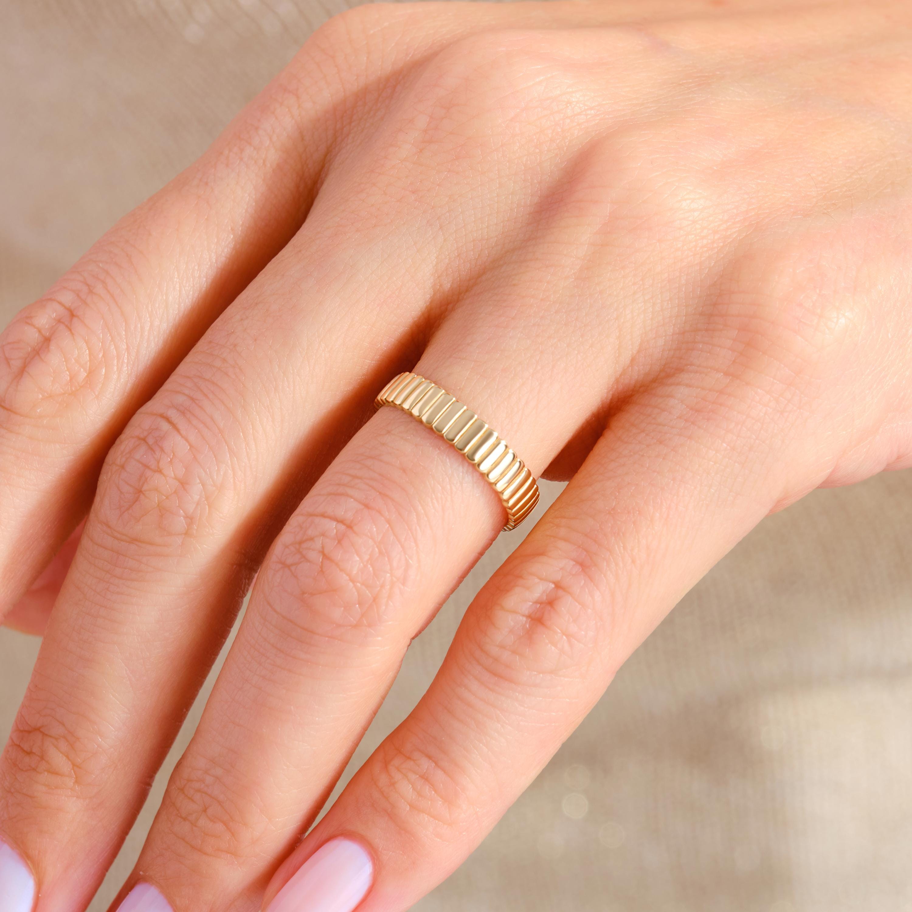 Ribbed Pave Diamond Wedding Band – 10K / 14K / 18K Solid Gold 💎🔥
A bold and beautiful designer ring with ribbed texture and tiny pave-set diamonds. Featuring a thick, tapered band in a luxurious cigar-style silhouette, this statement moissanite piece blends strength with sparkle. Perfect for modern brides, fashion-forward engagements, or stacking with your favorite rings 💫💛