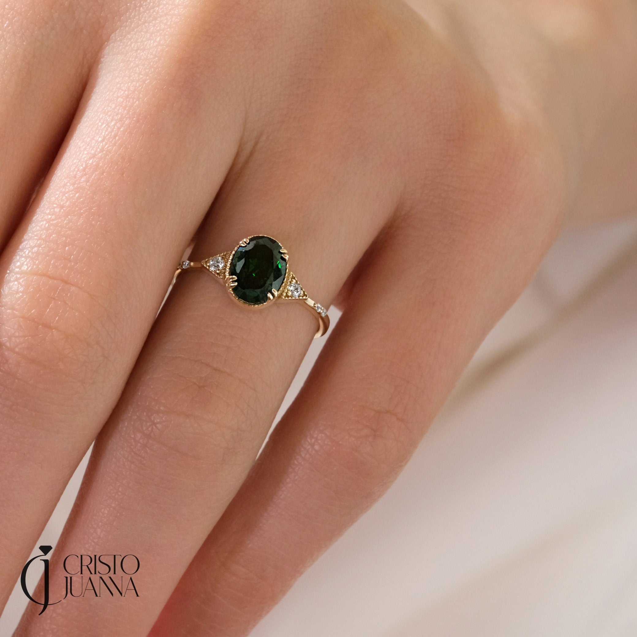 Oval Emerald Birthstone Ring – 10K / 14K / 18K Solid Gold 💚✨
A timeless oval emerald birthstone ring paired with sparkling diamonds, designed in an art deco style. This dainty and elegant piece is perfect as a promise ring, birthday gift, or a meaningful heirloom jewelry for your loved ones.