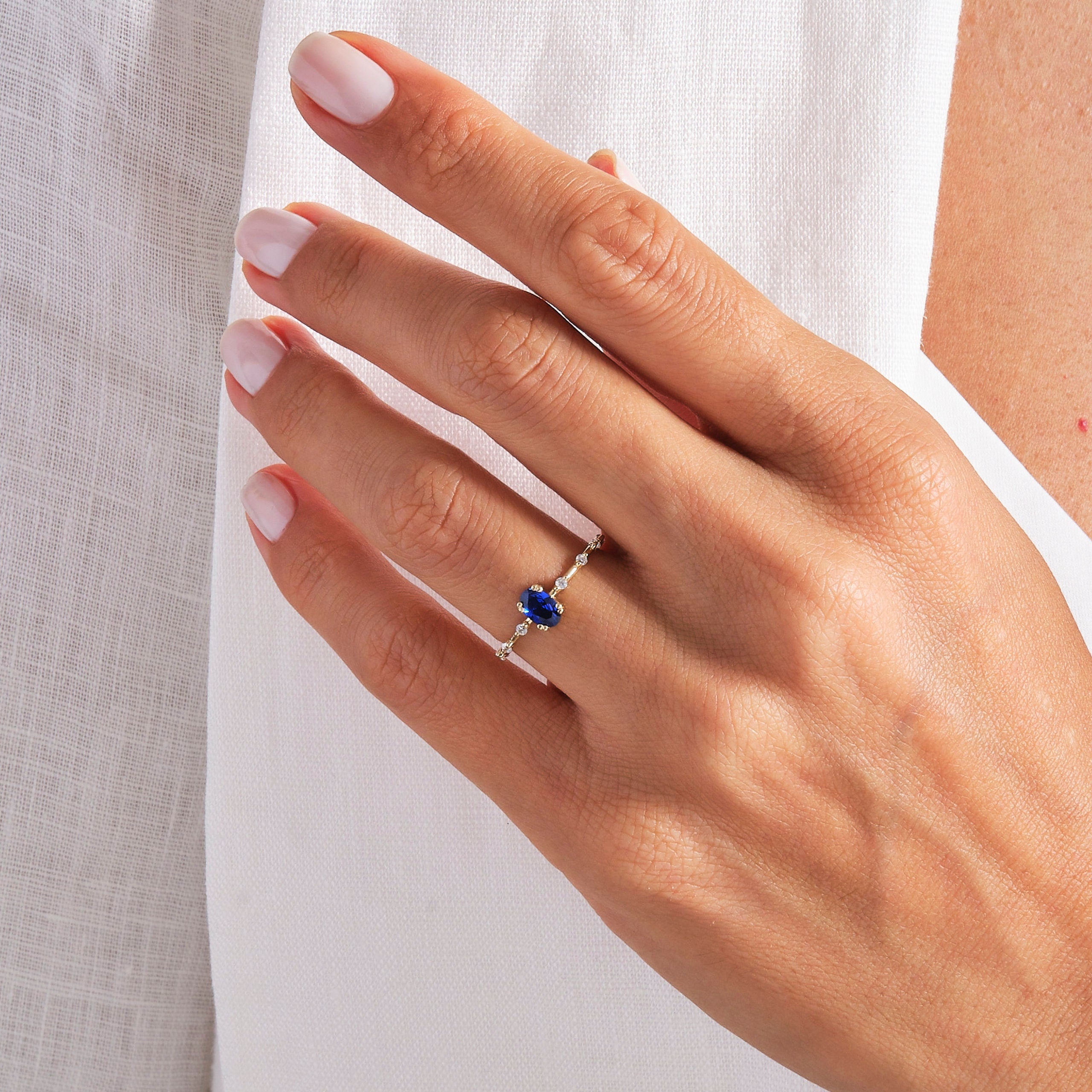 Oval Sapphire Engagement Ring – 14K Solid Gold ✨💙
A stunning oval blue sapphire engagement ring accented with sparkling side diamonds. Perfect for September birthdays or anyone who loves classic elegance, this ring can be customized with Diamond or Moissanite for the perfect shine. 💍