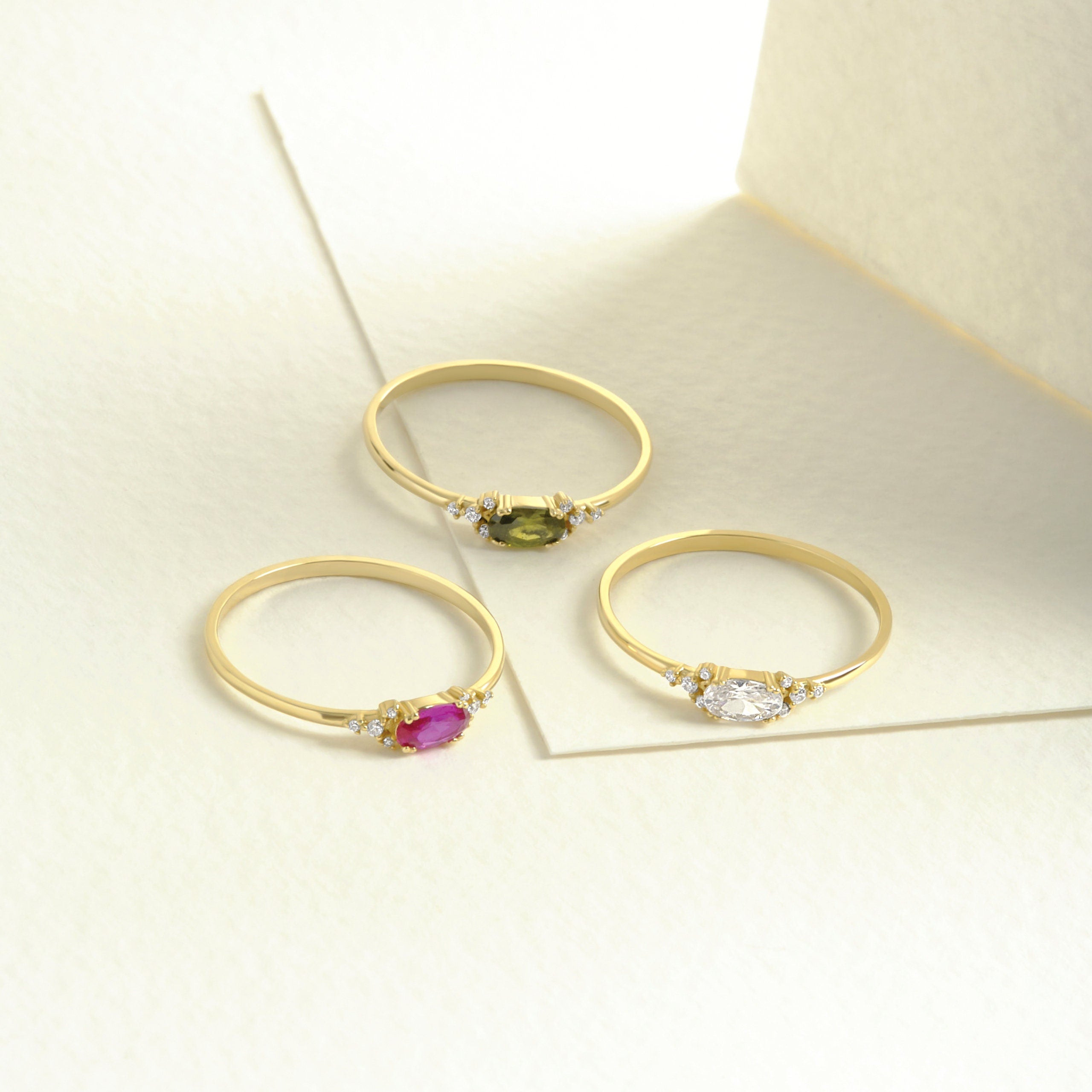 14K Gold Peridot Diamond Ring – Dainty Oval Birthstone Stacking Band 💚✨
Celebrate elegance and meaning with this handcrafted gold peridot ring, featuring a vibrant natural oval peridot and sparkling diamond or moissanite accents. Designed to be worn solo or as part of a dainty stacking ring set, this gemstone band radiates warmth, light, and timeless charm.