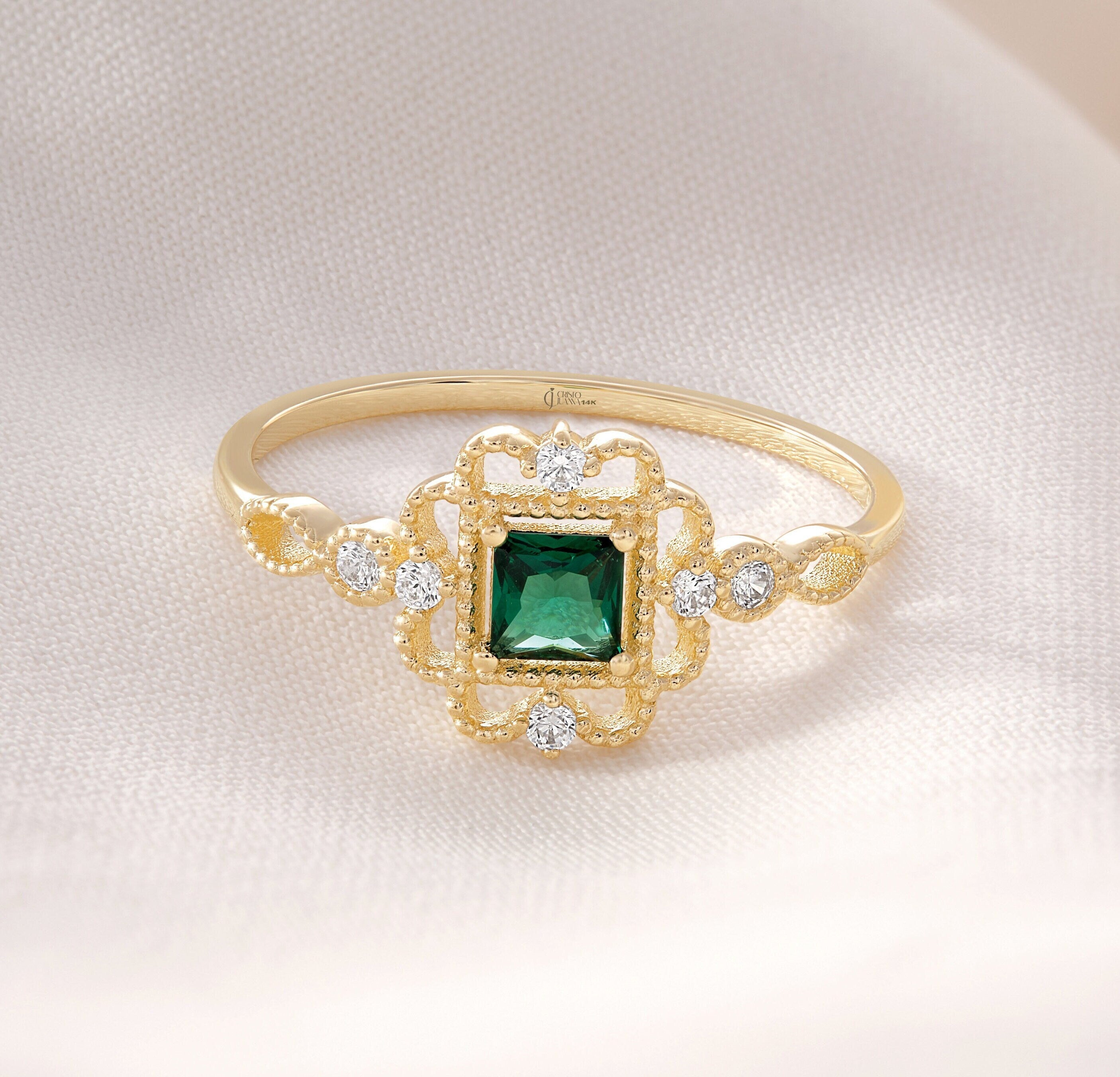 Princess Cut Emerald Engagement Ring – 10K / 14K / 18K Solid Gold 💚✨
A vibrant princess-cut emerald set in a delicate band accented with sparkling round diamonds. Its square silhouette and art deco charm make it a timeless engagement, promise, or birthstone ring. A perfect gift for emerald lovers and vintage jewelry enthusiasts.