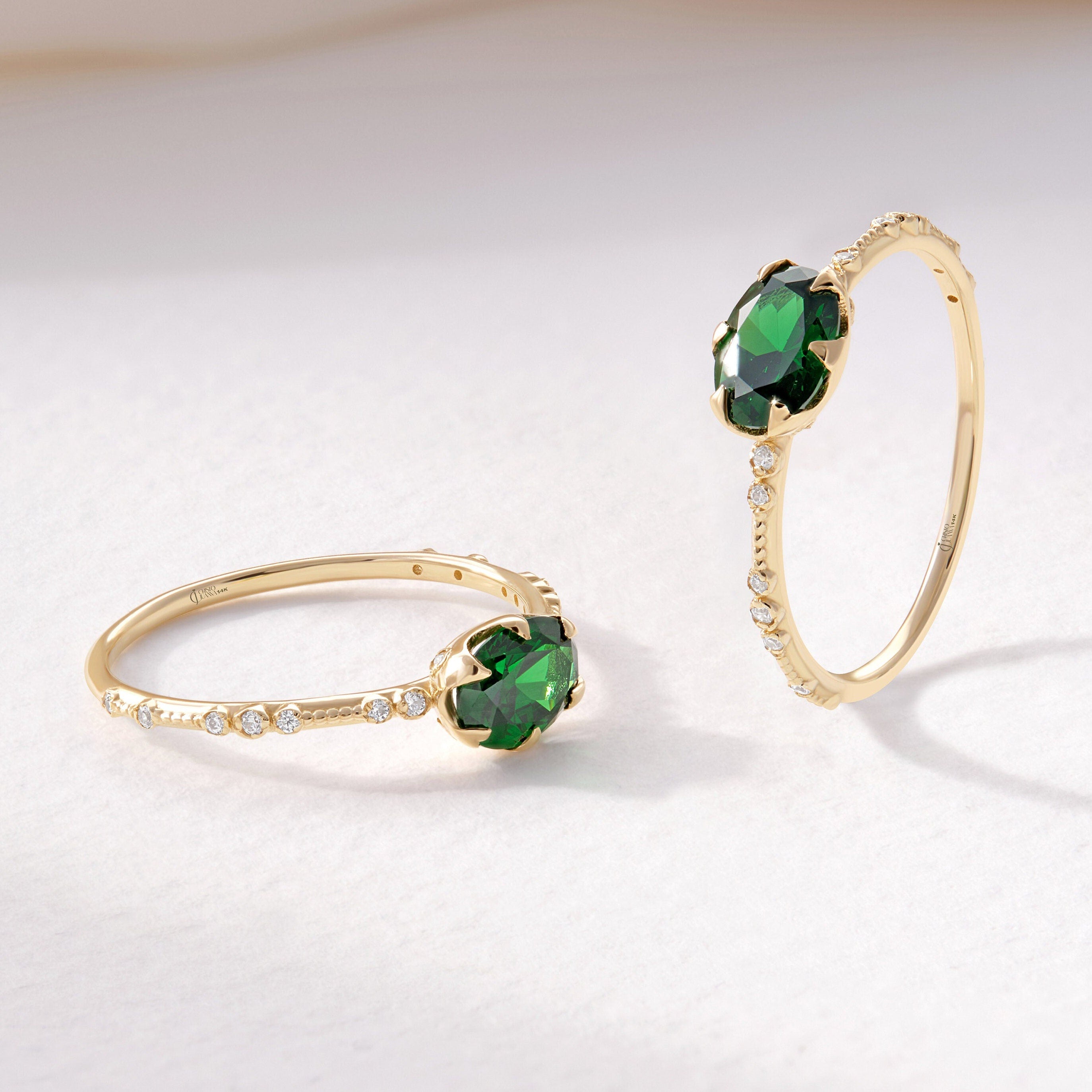 Oval Emerald Engagement Ring – 14K Solid Gold Side Diamond Band 💚✨
A timeless design for the elegant soul — this Oval Emerald Engagement Ring captures sophistication and sentiment. Handcrafted in solid 14K gold, it features a radiant 7x5 mm oval-cut emerald framed by sparkling side diamonds or moissanites, creating a graceful harmony of color and brilliance.
