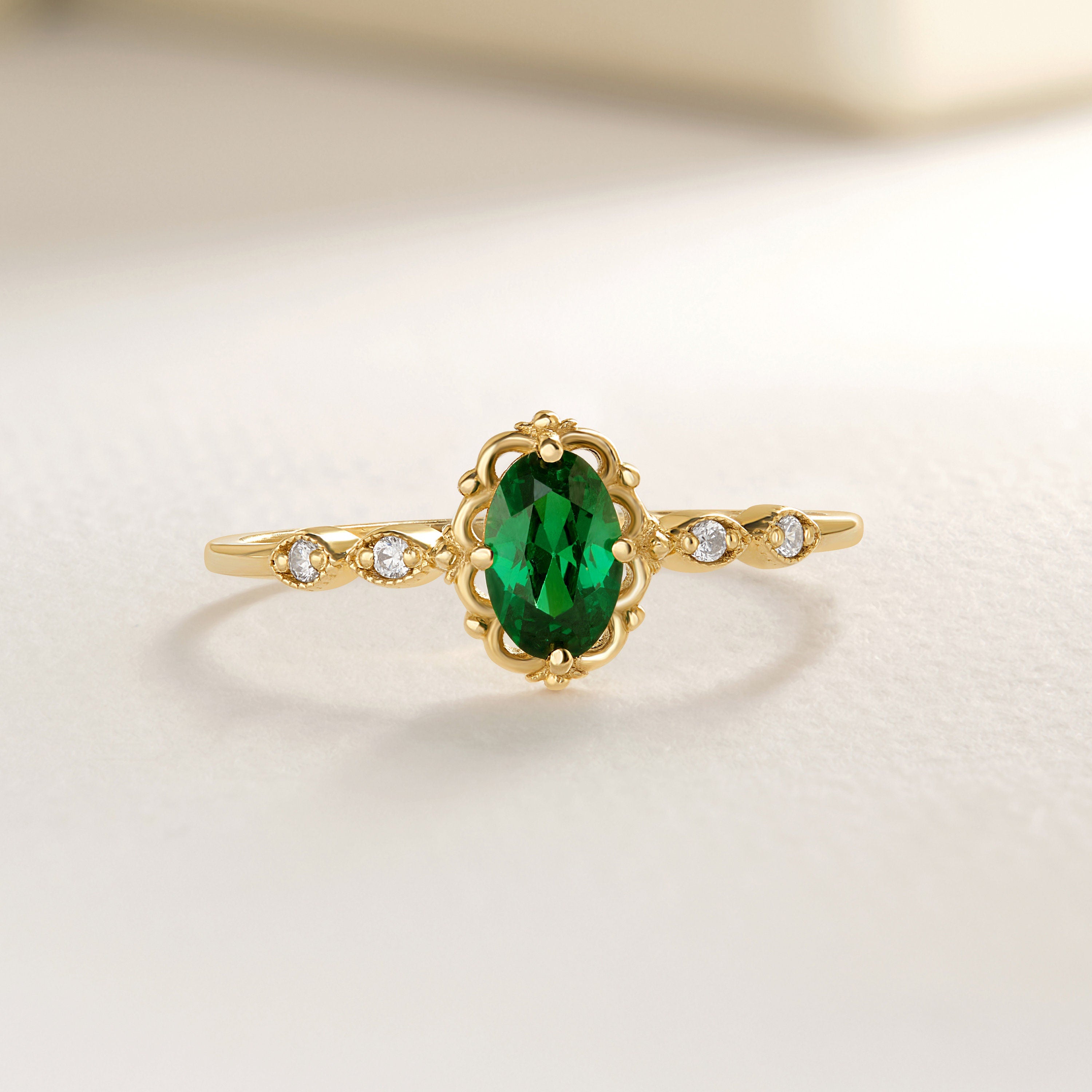 14K Solid Gold Natural Emerald Wedding Ring – Genuine Birthstone Engagement Ring 💚💎

Celebrate love, elegance, and the beauty of nature with this Natural Emerald Ring, expertly handcrafted in your choice of 10K, 14K, or 18K solid gold. Featuring a stunning oval-cut emerald center stone accented with sparkling side diamonds or moissanite, this ring is perfect as a birthstone engagement ring, a meaningful green wedding ring, or a cherished gift for her.