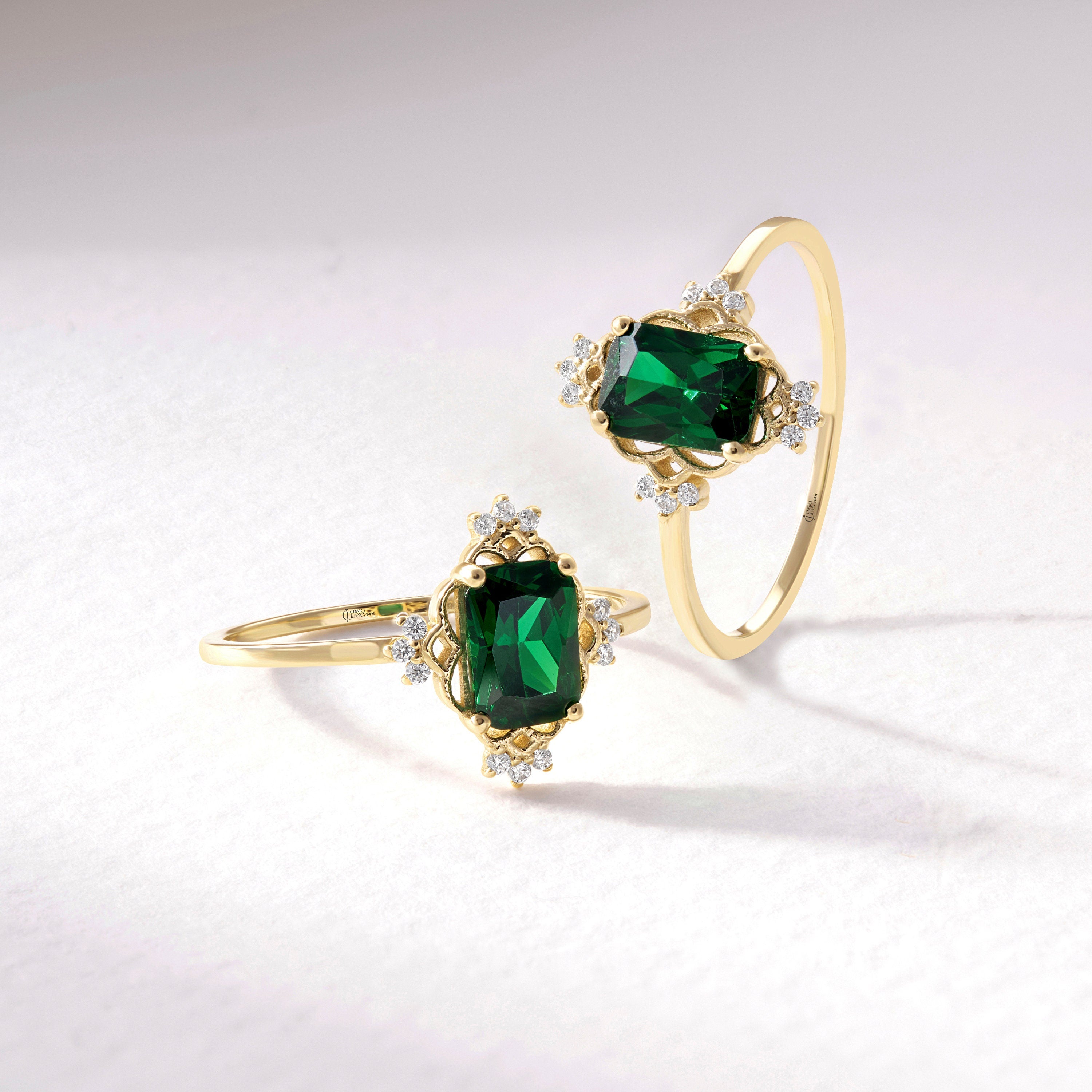 Emerald Cut Emerald Wedding Ring – 14K Solid Gold Band with Side Diamonds 💚✨
This Emerald Cut Wedding Ring celebrates timeless beauty and craftsmanship. Featuring a stunning 7x5 mm natural emerald surrounded by sparkling side diamonds, it radiates sophistication and meaning. The rectangular emerald symbolizes renewal and growth — a perfect piece for weddings, anniversaries, or milestone celebrations.