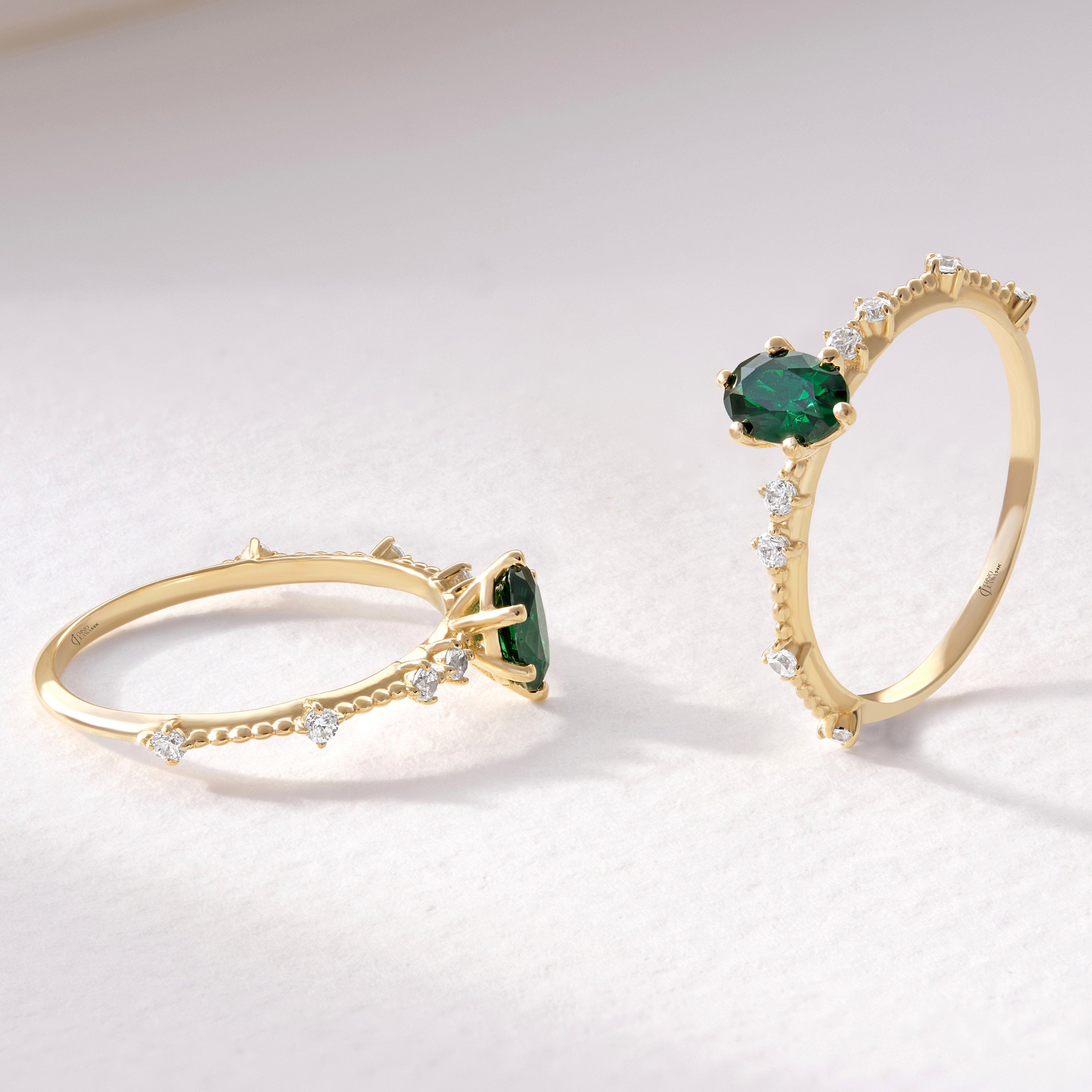 Oval Emerald Engagement Ring – 14K Solid Gold with Side Diamonds 💚✨
Elegant, timeless, and deeply symbolic — this oval emerald engagement ring celebrates love and renewal in every detail. Featuring a vivid green oval-cut emerald at its center, delicately framed by a fine row of tiny moissanite diamonds, this piece perfectly balances luxury and sentiment. Its milgrain side detailing adds a subtle vintage touch, making it an ideal ring for weddings, anniversaries, or heartfelt gifts.