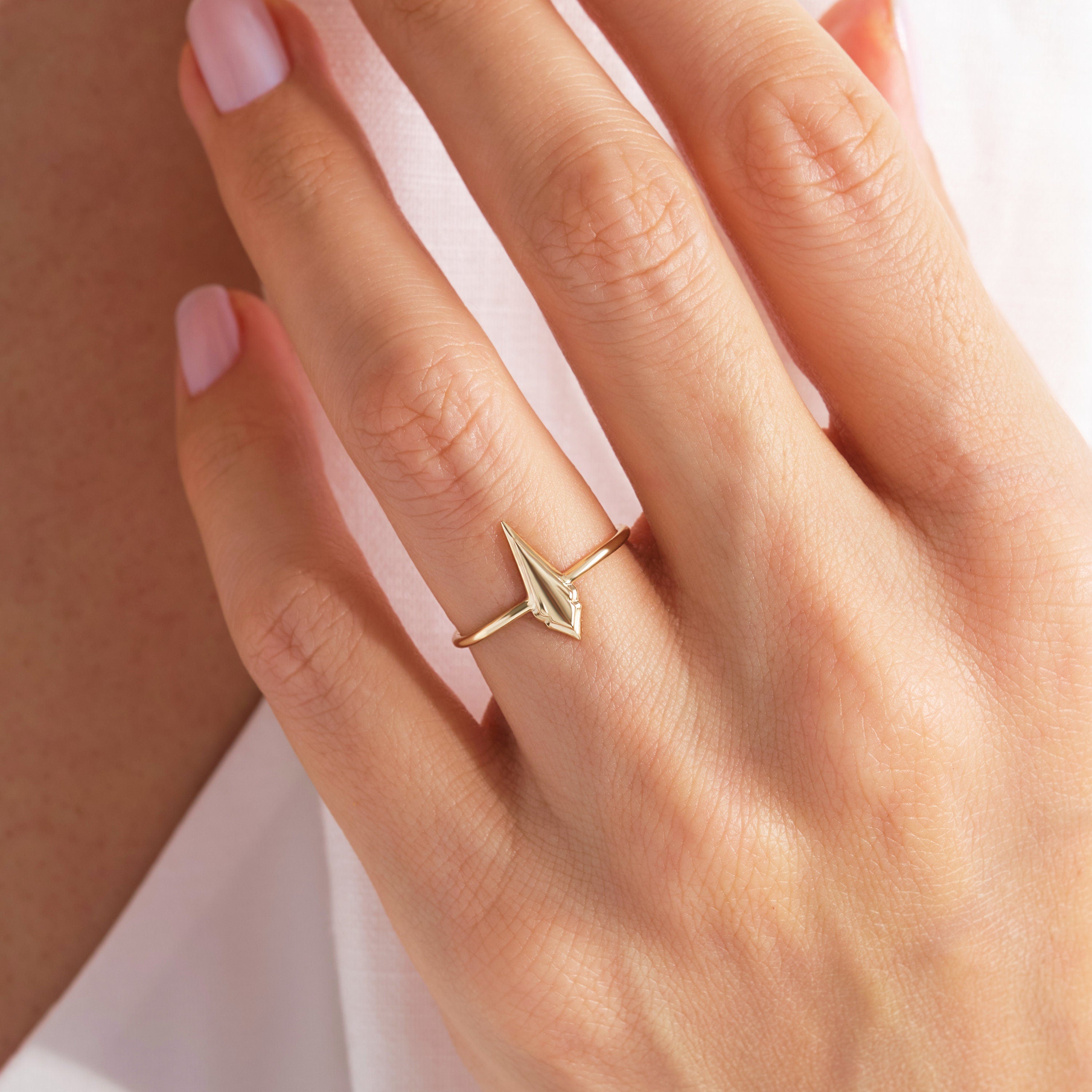 💍 Spike Kite Signet Ring — 14K Solid Gold Unique Designer Band

This modern spike–kite signet ring features a bold geometric silhouette crafted entirely from solid gold. Designed for women who love contemporary, sculptural jewelry, it’s perfect as a stackable ring, statement piece, or meaningful gift. Its sleek, polished finish brings a refined yet edgy touch to any collection.