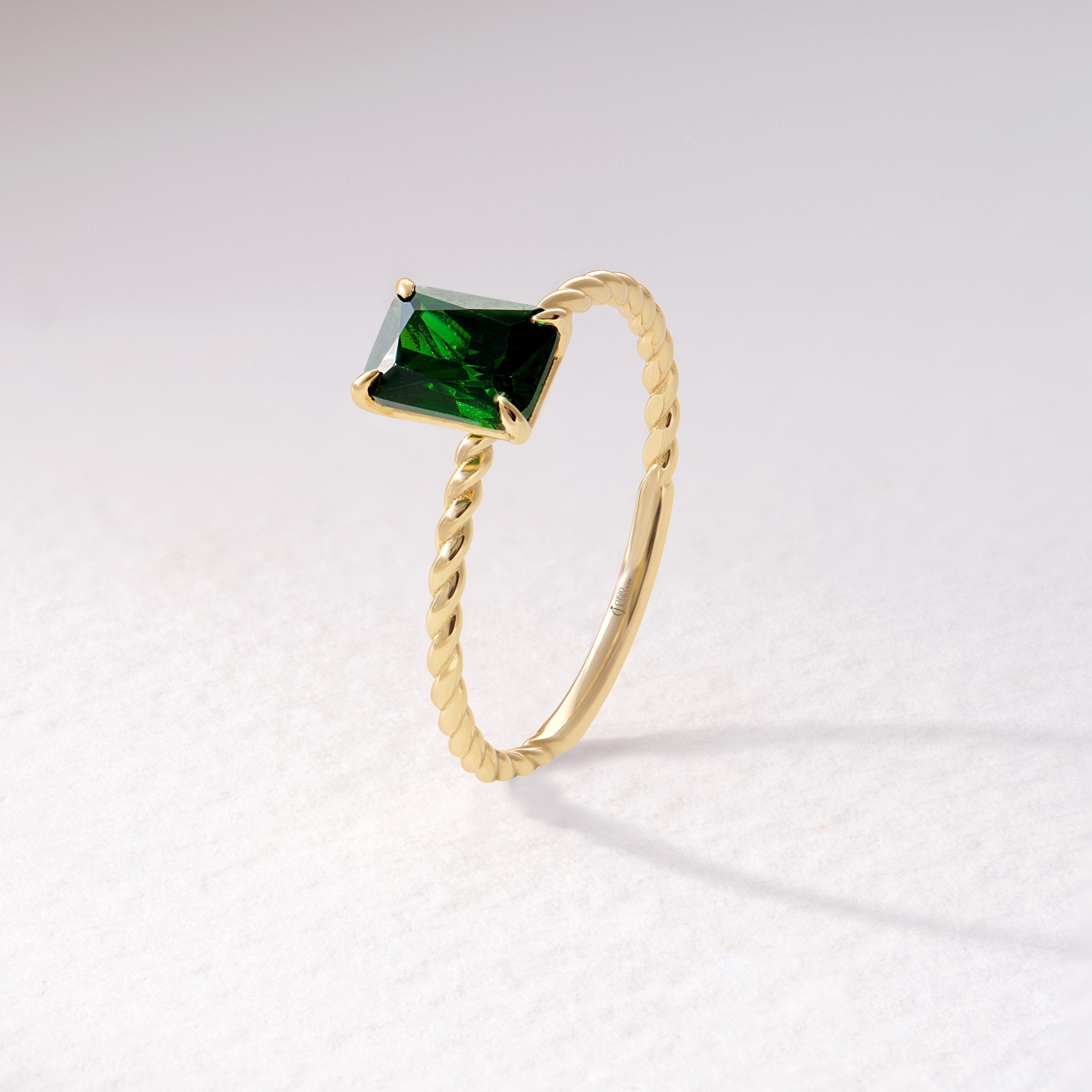 Emerald Cut Emerald Ring – 14K Solid Gold Twisted Rope Band 💚✨
This emerald cut emerald ring blends timeless sophistication with artisanal design. The deep green rectangular gemstone is beautifully framed by a twisted rope band, handcrafted in solid 14K gold for a touch of vintage luxury. Whether worn solo or stacked, it’s a graceful statement of renewal, elegance, and individuality — perfect as a birthstone, anniversary, or Christmas gift.