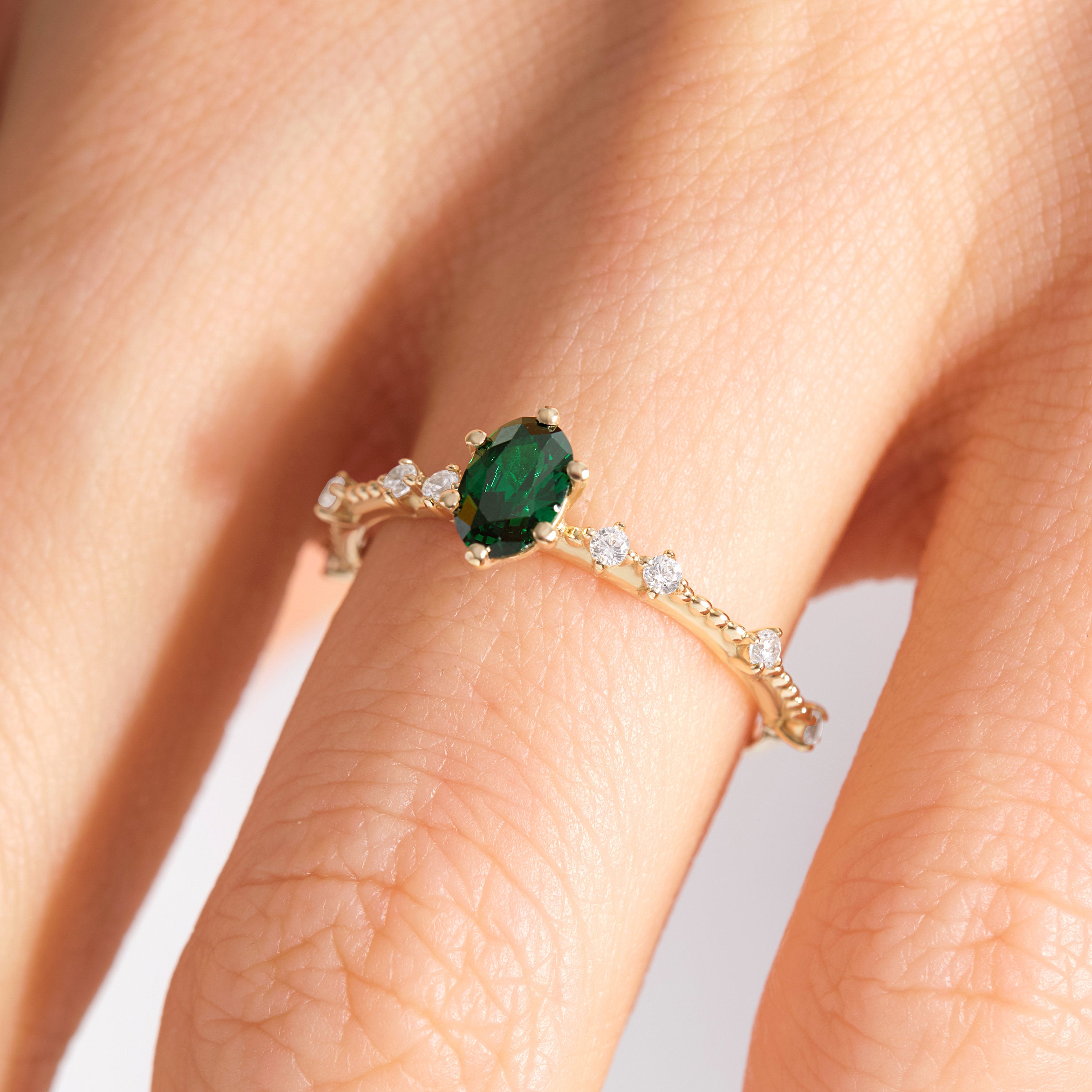 Oval Emerald Engagement Ring – 14K Solid Gold with Side Diamonds 💚✨
Elegant, timeless, and deeply symbolic — this oval emerald engagement ring celebrates love and renewal in every detail. Featuring a vivid green oval-cut emerald at its center, delicately framed by a fine row of tiny moissanite diamonds, this piece perfectly balances luxury and sentiment. Its milgrain side detailing adds a subtle vintage touch, making it an ideal ring for weddings, anniversaries, or heartfelt gifts.