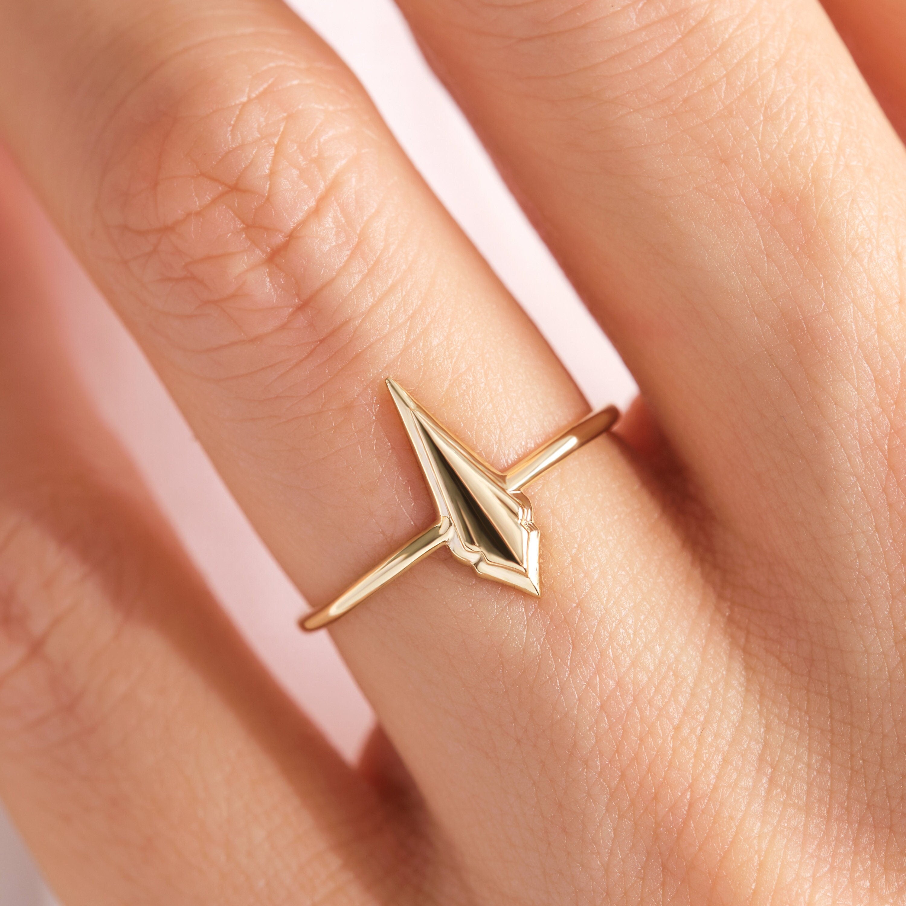 💍 Spike Kite Signet Ring — 14K Solid Gold Unique Designer Band

This modern spike–kite signet ring features a bold geometric silhouette crafted entirely from solid gold. Designed for women who love contemporary, sculptural jewelry, it’s perfect as a stackable ring, statement piece, or meaningful gift. Its sleek, polished finish brings a refined yet edgy touch to any collection.