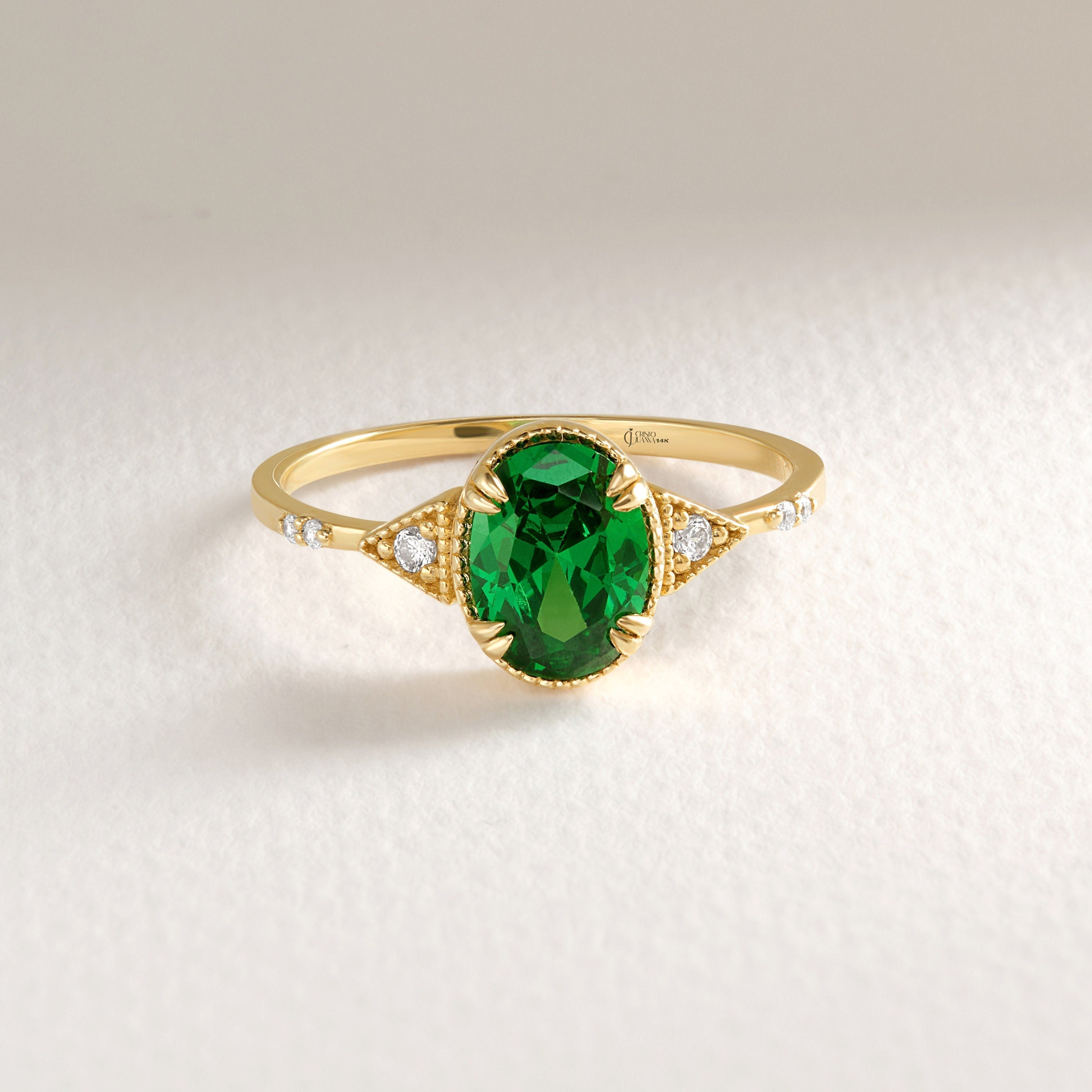 Oval Emerald Birthstone Ring – 10K / 14K / 18K Solid Gold 💚✨
A timeless oval emerald birthstone ring paired with sparkling diamonds, designed in an art deco style. This dainty and elegant piece is perfect as a promise ring, birthday gift, or a meaningful heirloom jewelry for your loved ones.
