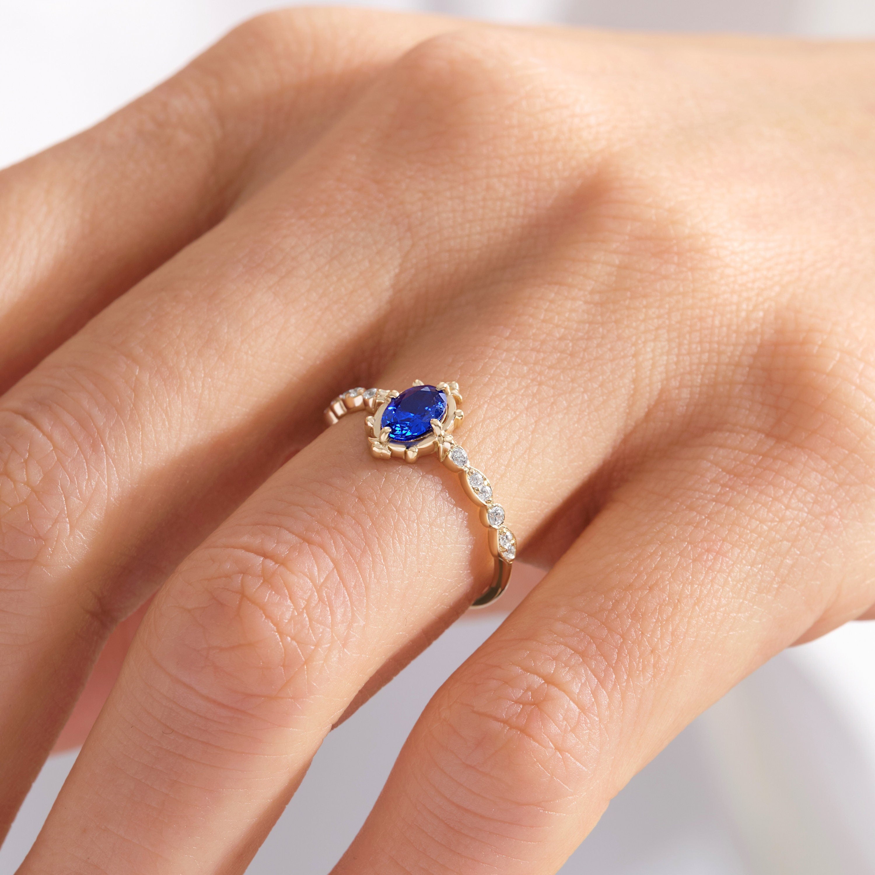 Oval Sapphire Engagement Ring – 10K / 14K / 18K Solid Gold 💙✨
This stunning oval sapphire ring sparkles with round-cut side diamonds, creating a timeless engagement or promise ring. A vintage-inspired design that combines elegance and symbolism, making it a perfect heirloom piece.