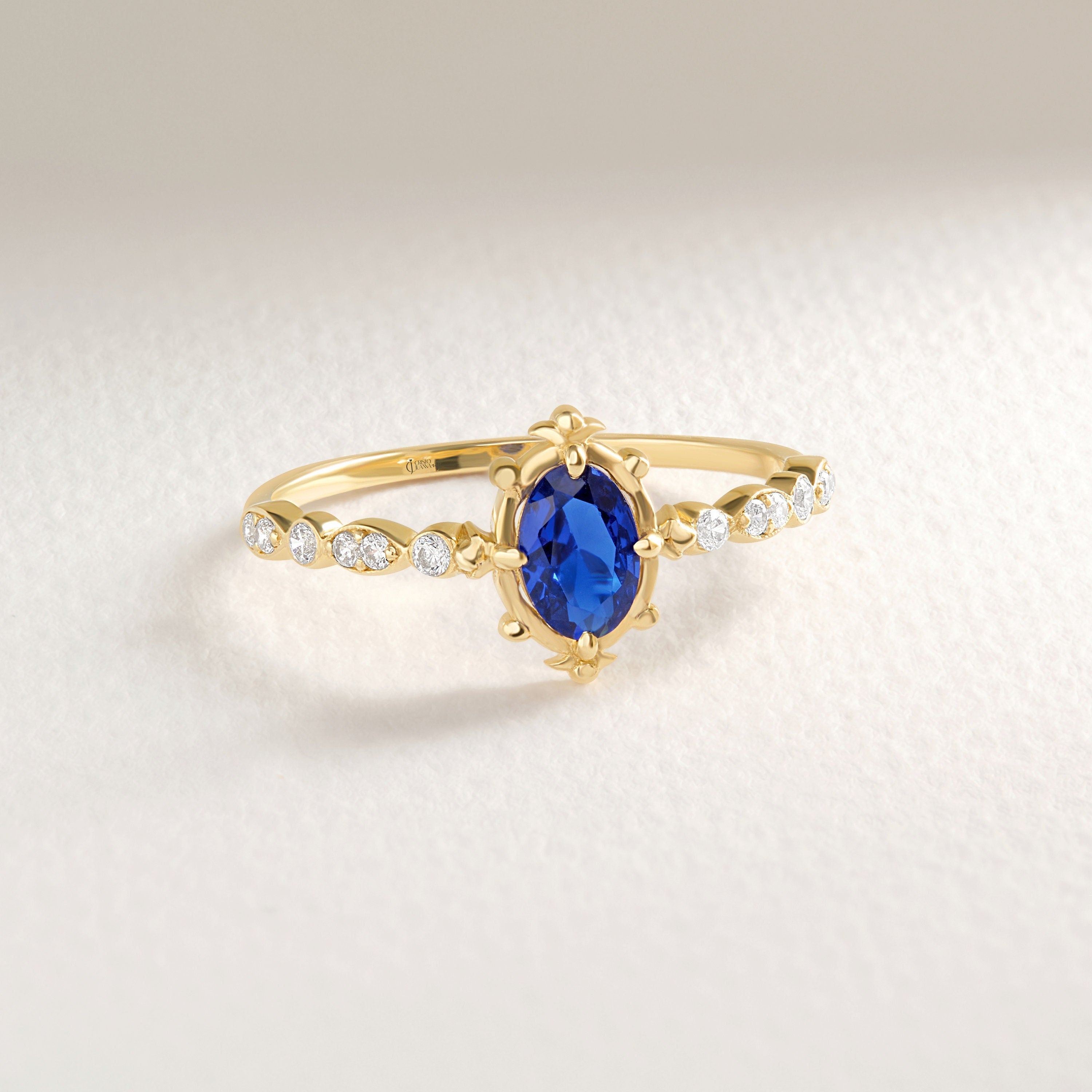 Oval Sapphire Engagement Ring – 10K / 14K / 18K Solid Gold 💙✨
This stunning oval sapphire ring sparkles with round-cut side diamonds, creating a timeless engagement or promise ring. A vintage-inspired design that combines elegance and symbolism, making it a perfect heirloom piece.