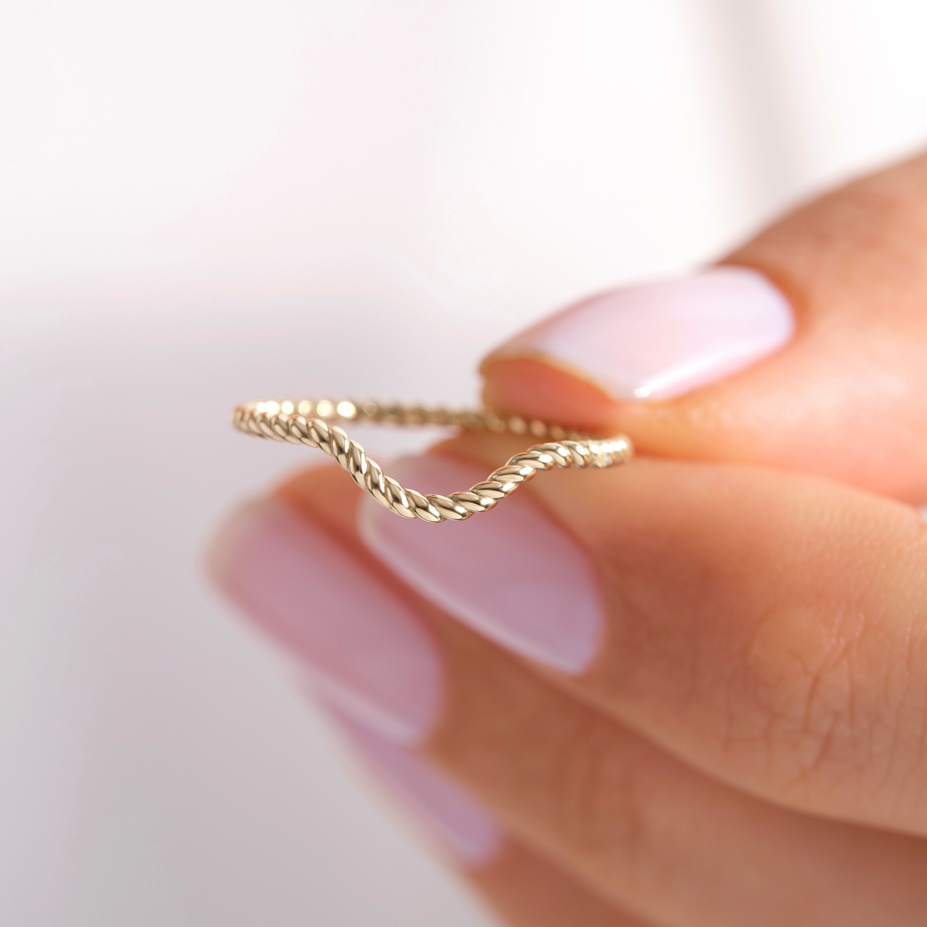 💍 V-Shaped Chevron Wedding Band – 14K Solid Gold

This elegant V-shaped ring features a smooth polished band with a subtle wave silhouette, creating a modern chevron look that pairs beautifully with engagement rings. Its curved wishbone shape makes it perfect for nesting, stacking, or wearing alone as a delicate everyday gold band. ✨