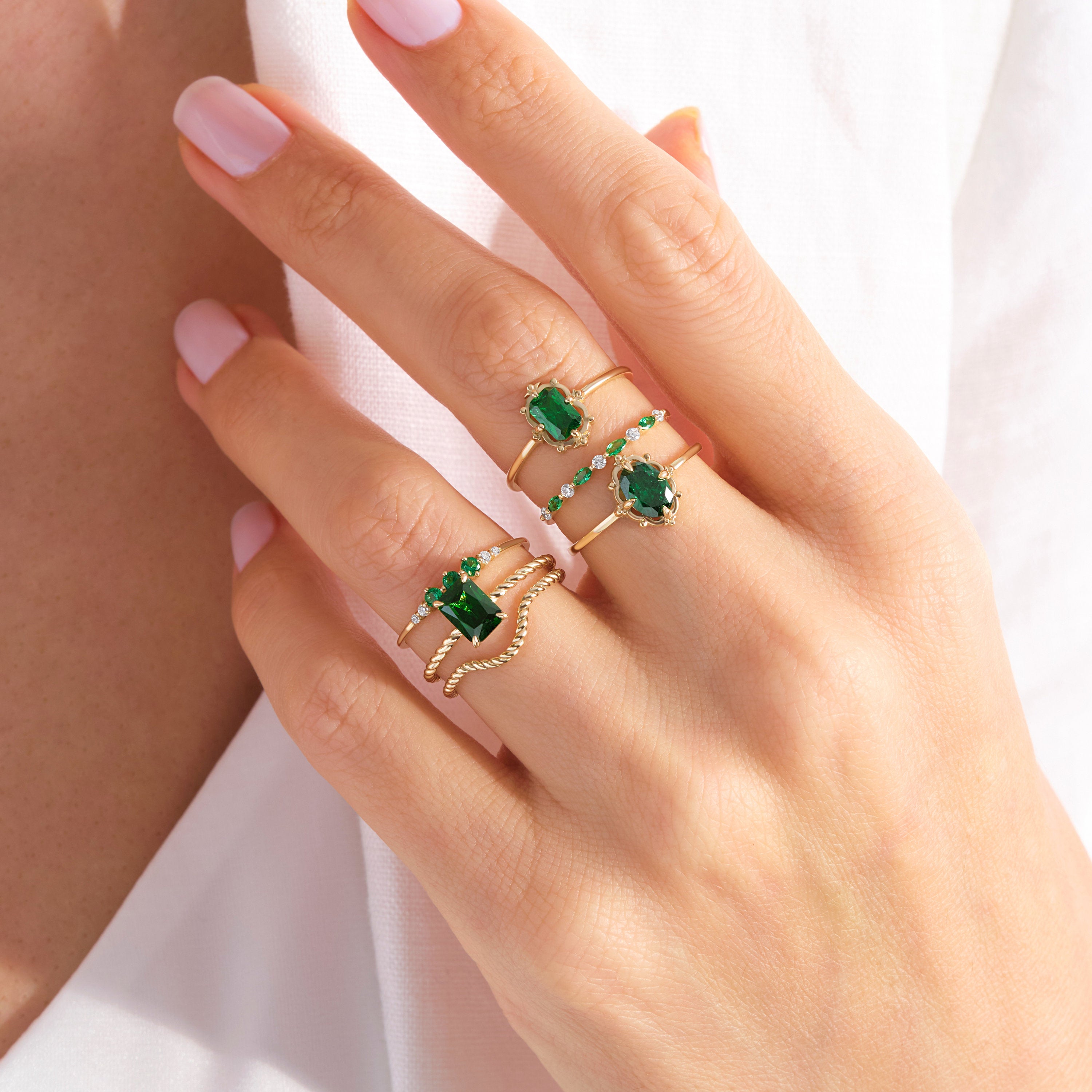 Round Emerald & Diamond Three-Stone Ring – 14K Solid Gold 💚💎
Elegant, symbolic, and full of meaning — this three-stone emerald ring represents love, balance, and renewal. Featuring three vivid round-cut emeralds accented by two sparkling side diamonds, it’s a modern heirloom designed for everyday sophistication or milestone celebrations.