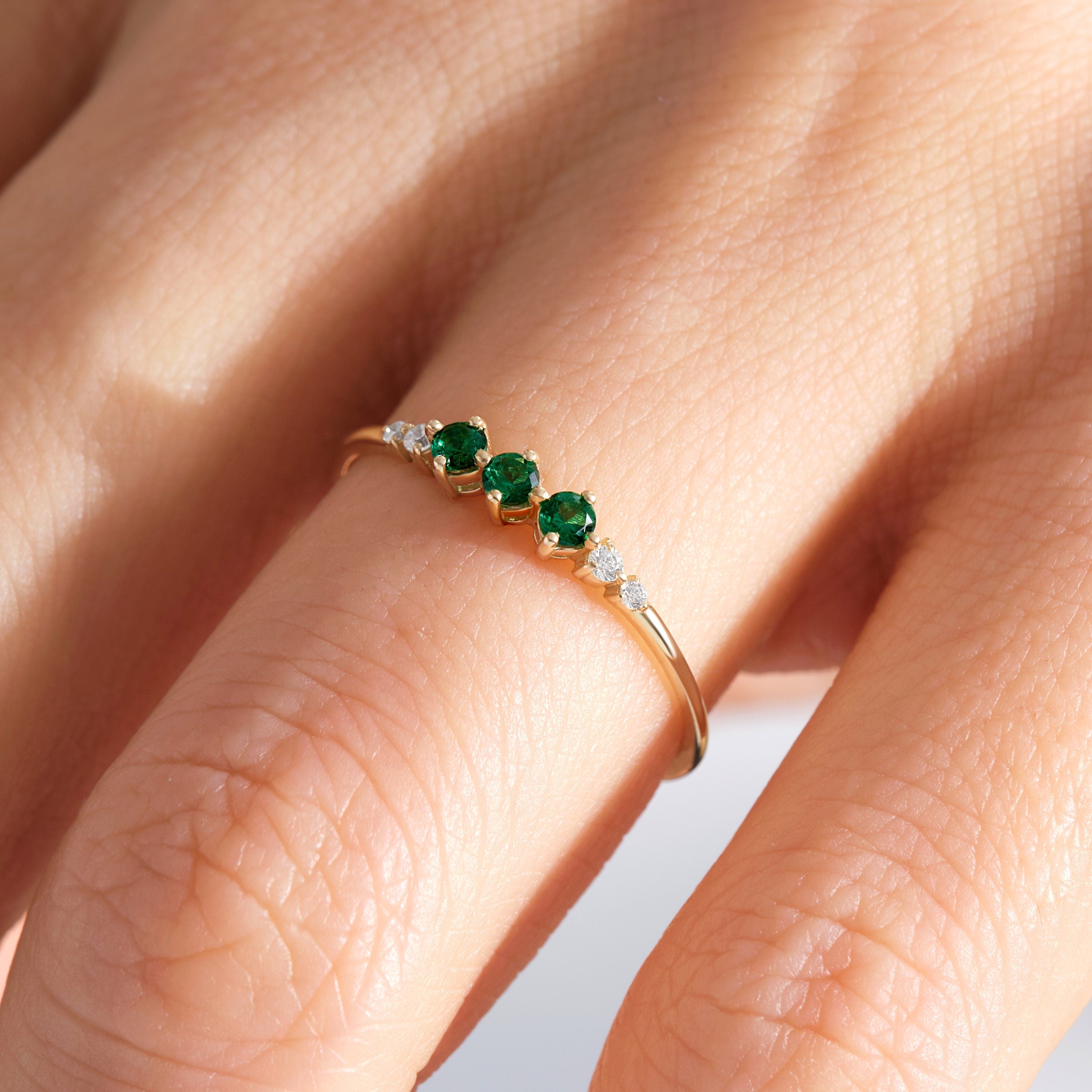 Round Emerald & Diamond Three-Stone Ring – 14K Solid Gold 💚💎
Elegant, symbolic, and full of meaning — this three-stone emerald ring represents love, balance, and renewal. Featuring three vivid round-cut emeralds accented by two sparkling side diamonds, it’s a modern heirloom designed for everyday sophistication or milestone celebrations.