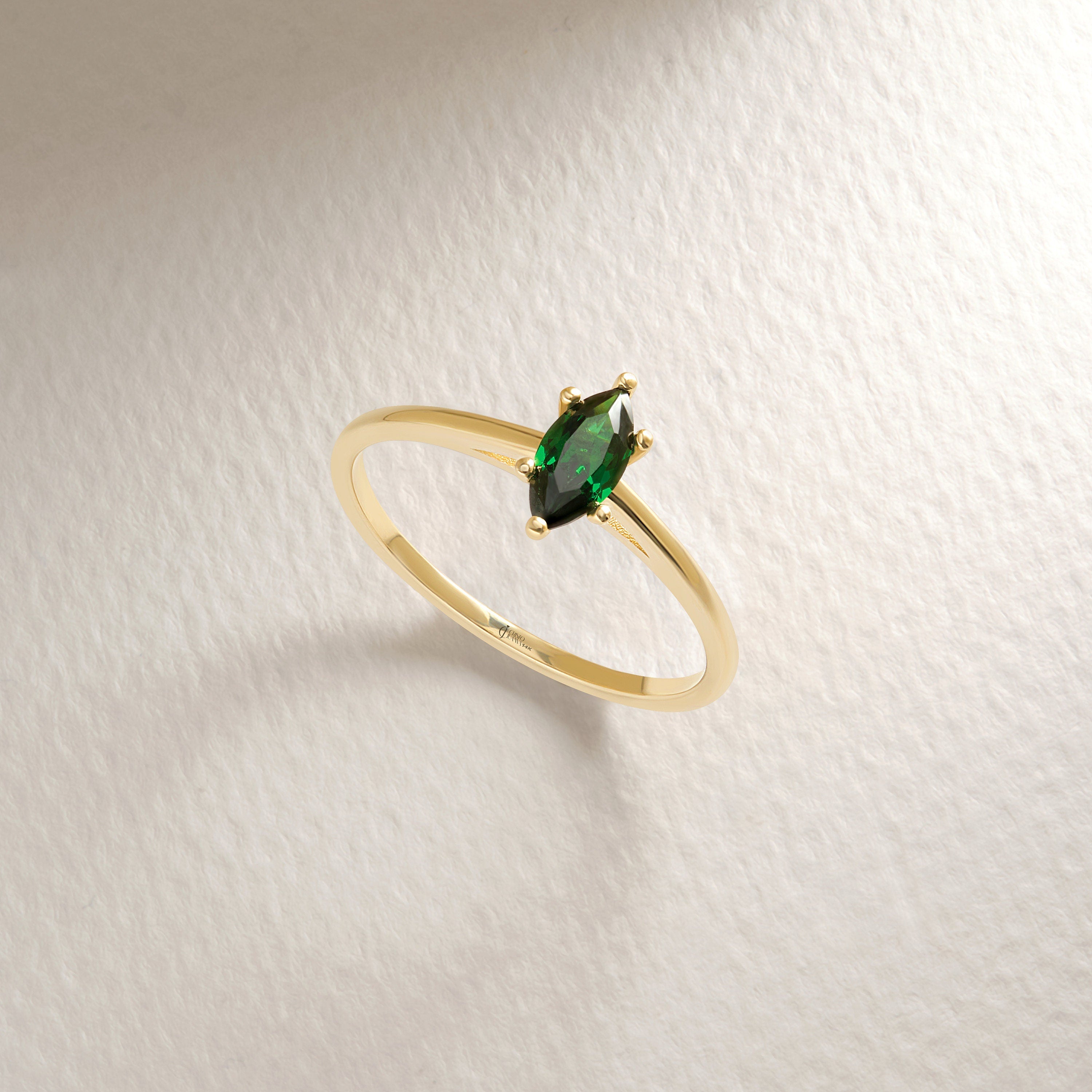 Here is our marquise cut emerald ring with 14K solid gold band for women! This solo birthstone ring for women and customize single stone ring will be perfect gift for her wedding or engagement ceremony.