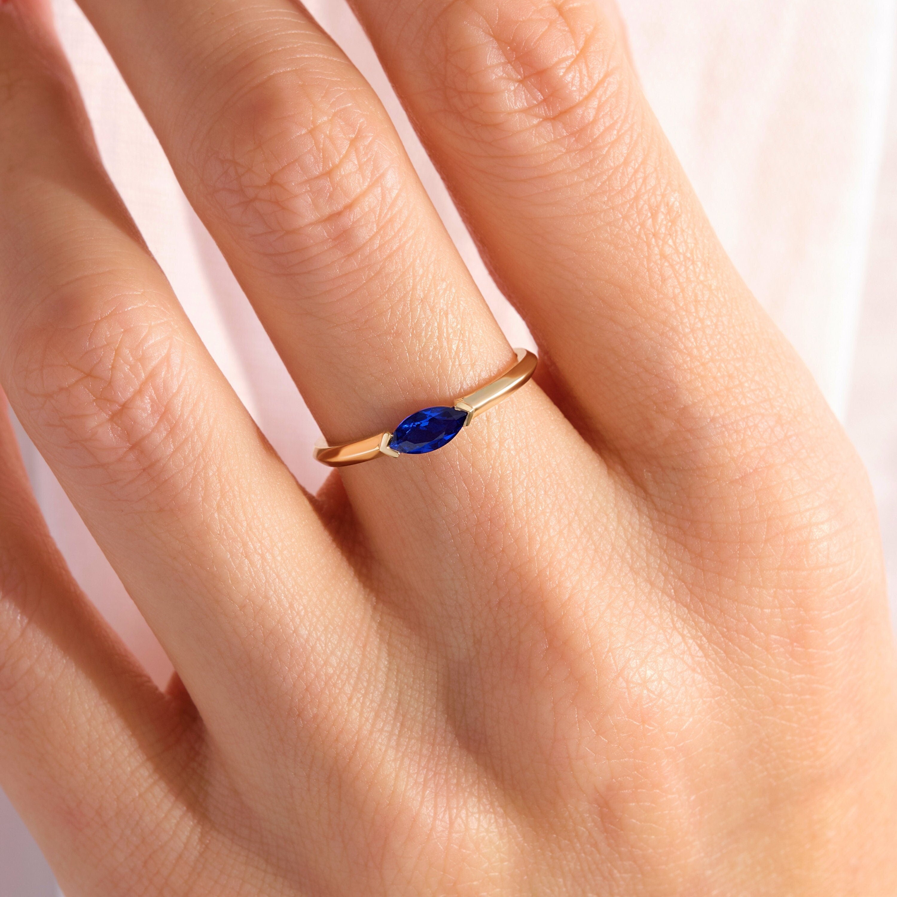 Marquise Sapphire Ring – 10K / 14K / 18K Solid Gold ✨💙
Elegant and timeless, this marquise cut sapphire ring makes the perfect September birthstone jewelry. Its dainty, stackable design is ideal for everyday wear and also a meaningful gift for someone special.