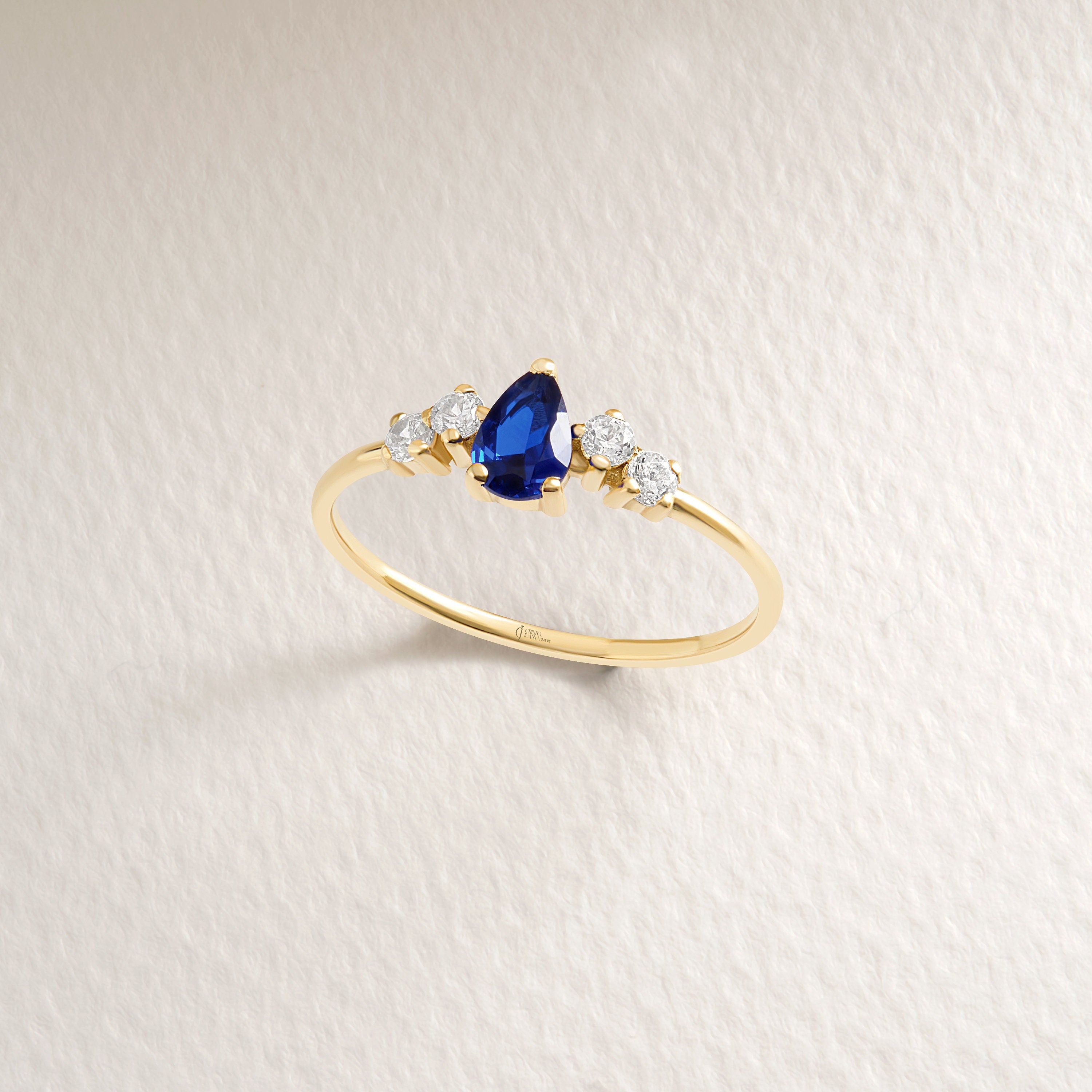 Pear Blue Sapphire Engagement Ring – 10K / 14K / 18K Solid Gold 💙✨
A stunning pear-cut blue sapphire set with sparkling diamond side stones. This timeless teardrop design symbolizes purity and love, making it a perfect engagement, anniversary, or September birthstone gift ring.