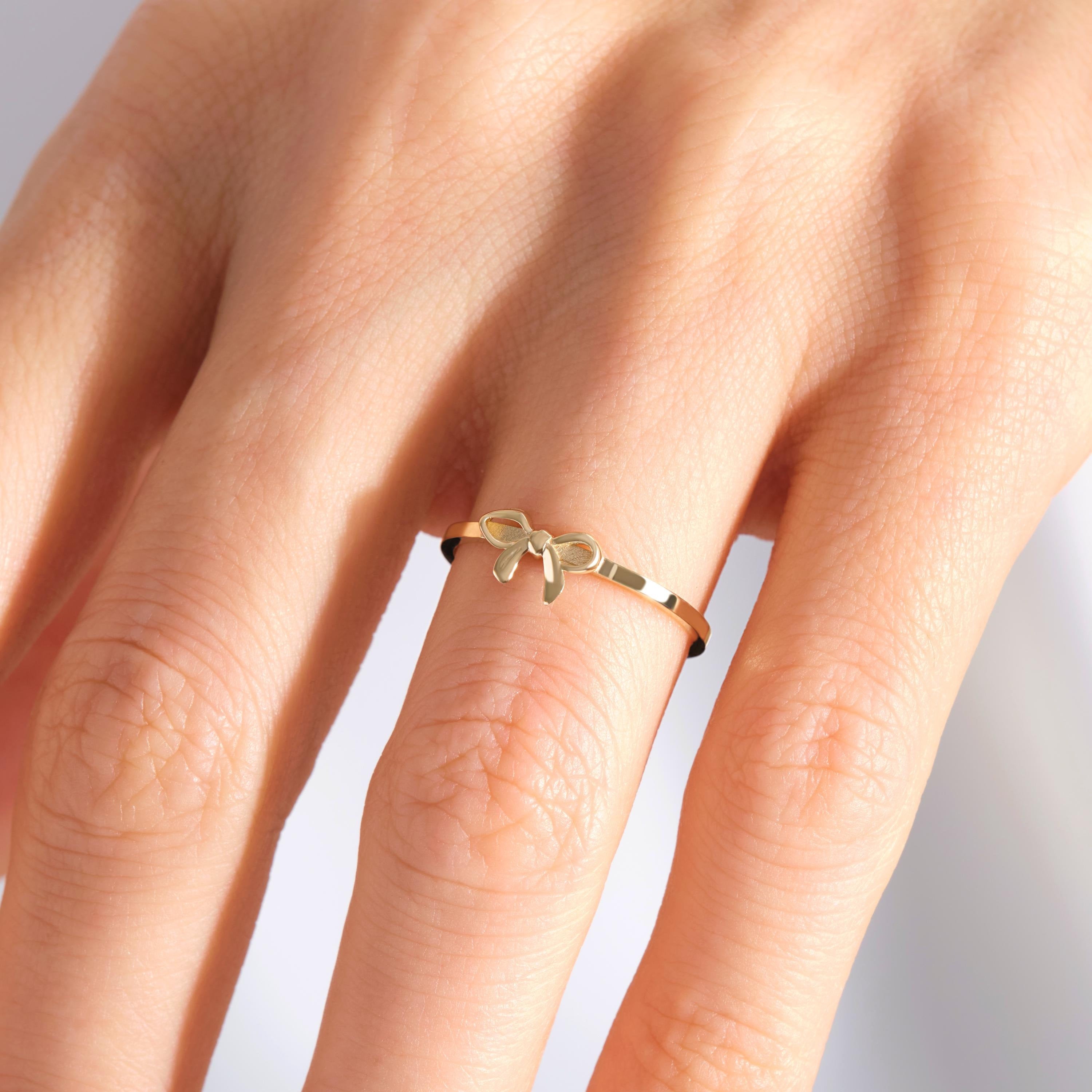 Ribbon Bow 14K Solid Gold Ring – Dainty Bowtie Stacking Ring for Women 🎀✨
Sweet, feminine, and full of charm — this Ribbon Bow Ring is the perfect symbol of elegance and connection. Handcrafted from solid 14K gold, the delicate bowknot design makes it a timeless choice for stacking, gifting, or celebrating your closest bonds.