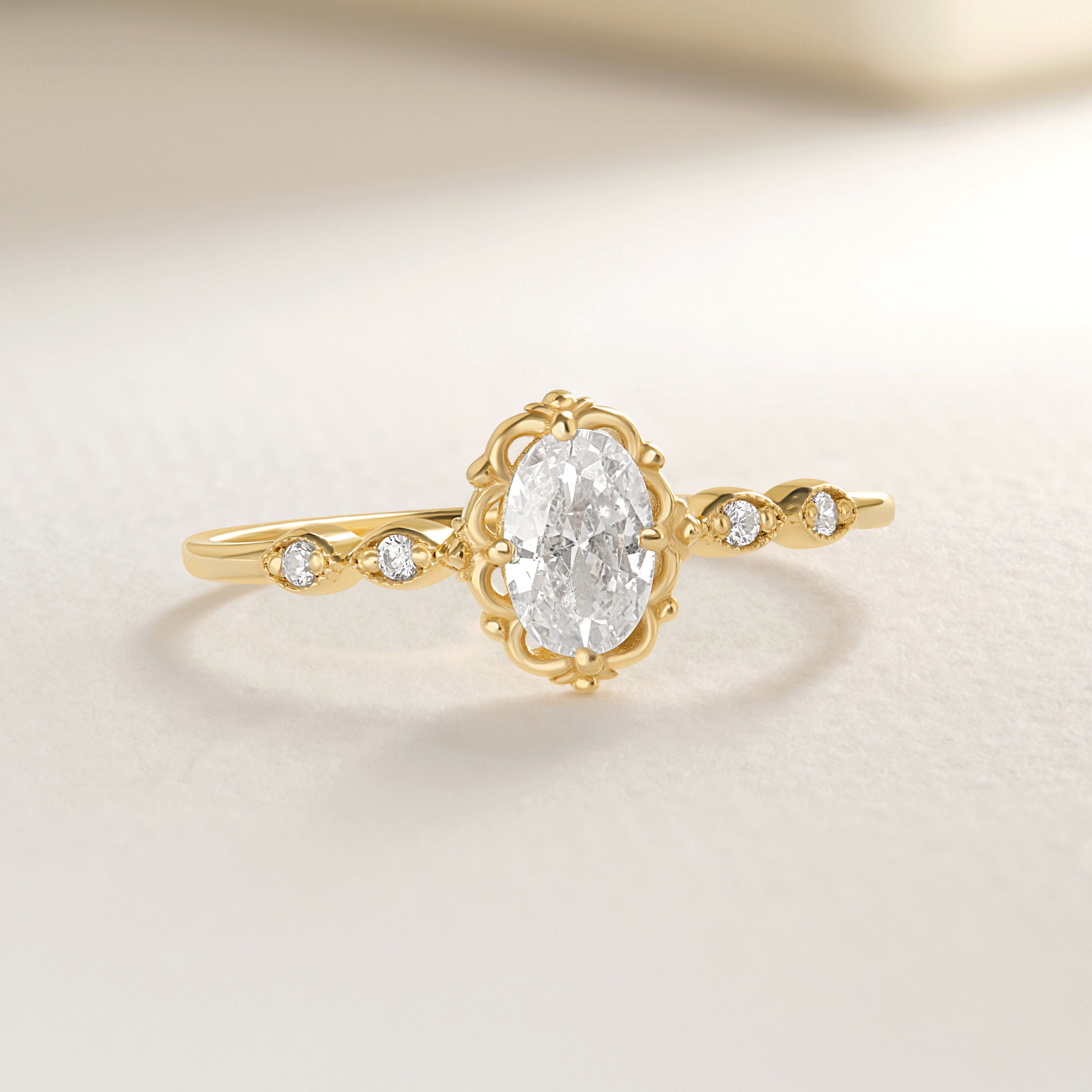 💍 Oval Diamond Engagement Ring — 14K Solid Gold Moissanite Wedding Band

This elegant oval engagement ring features a sparkling center stone paired with a delicate row of tiny accent gems. Its slim solid-gold band and refined silhouette make it perfect as a proposal ring, wedding band, promise ring, or everyday luxury piece. A timeless design for women who love delicate, feminine fine jewelry.