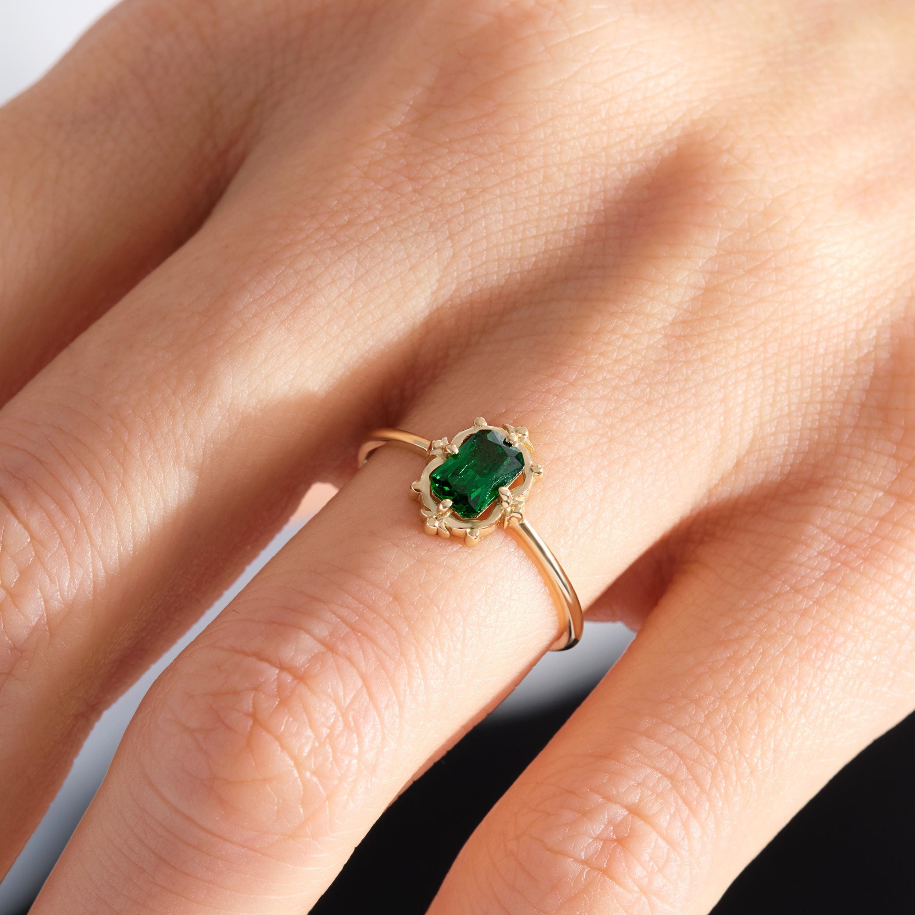 💚 Emerald Cut Emerald Engagement Ring – 14K Solid Gold 💚

Timeless and captivating, this Emerald Cut Emerald Engagement Ring combines vintage Art Deco elegance with modern craftsmanship. The striking green gemstone sits in a sleek rectangular setting, making it a perfect choice for engagements, anniversaries, or a meaningful everyday statement.