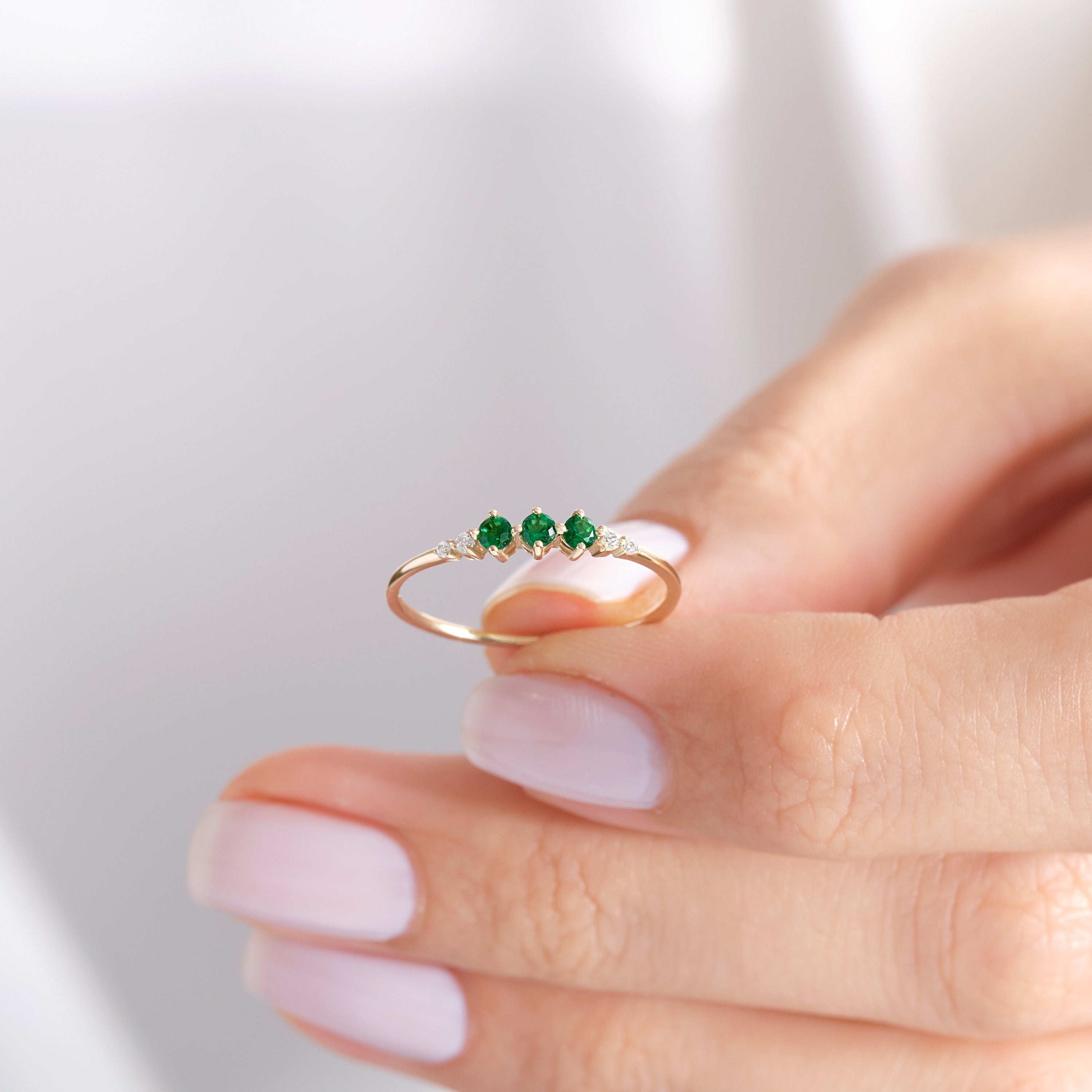 Round Emerald & Diamond Three-Stone Ring – 14K Solid Gold 💚💎
Elegant, symbolic, and full of meaning — this three-stone emerald ring represents love, balance, and renewal. Featuring three vivid round-cut emeralds accented by two sparkling side diamonds, it’s a modern heirloom designed for everyday sophistication or milestone celebrations.