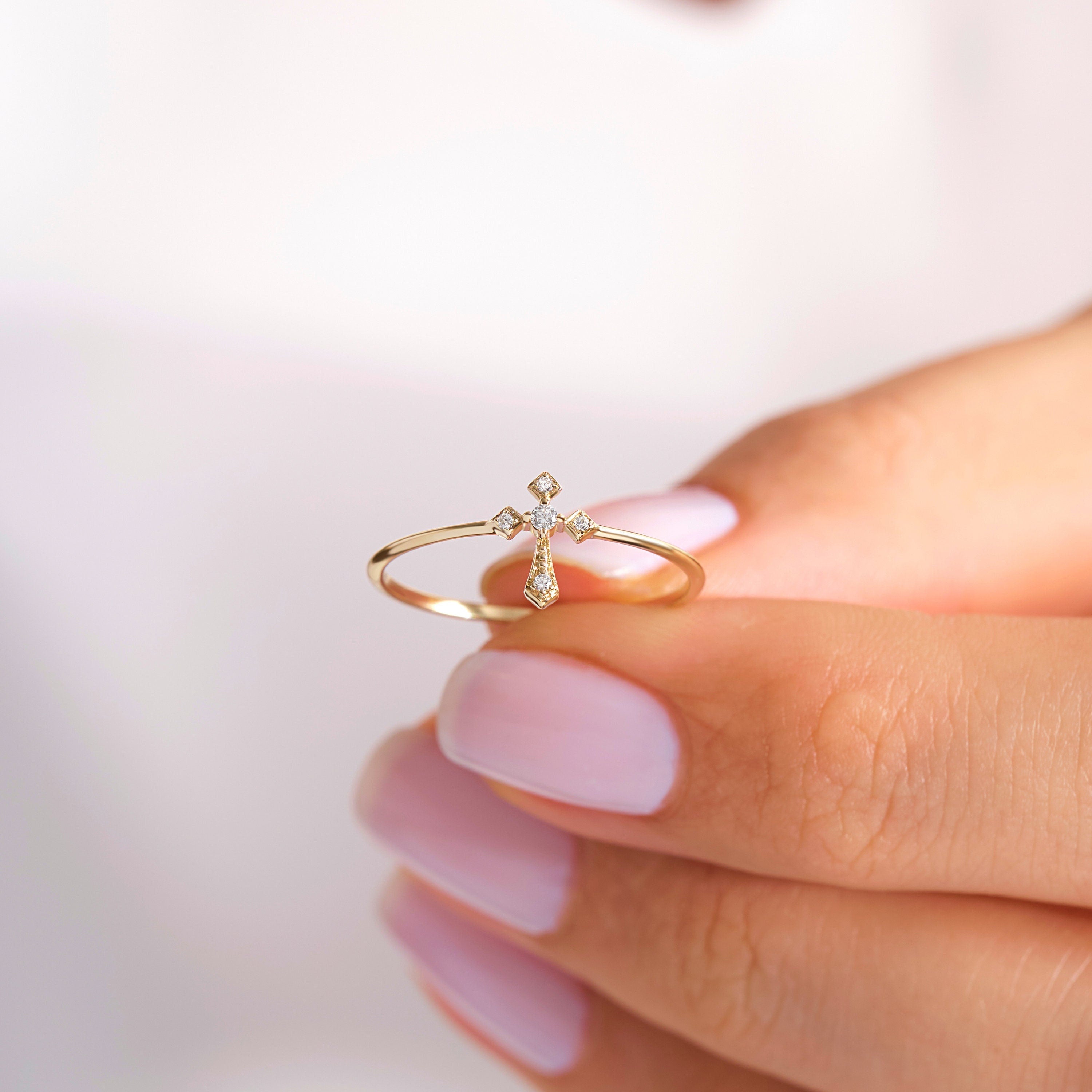 14K Solid Gold Cross Diamond Ring – Stackable Religious Rosary Band ✝️💎
Graceful and symbolic, this cross diamond ring blends faith and elegance in a sleek, minimalist design. Perfect for daily wear or stacking, it’s a meaningful piece that honors spirituality and timeless style. Whether you wear it as a Christian ring for women, a baptism gift, or a simple religious 10K ring, this piece will always carry deep significance.