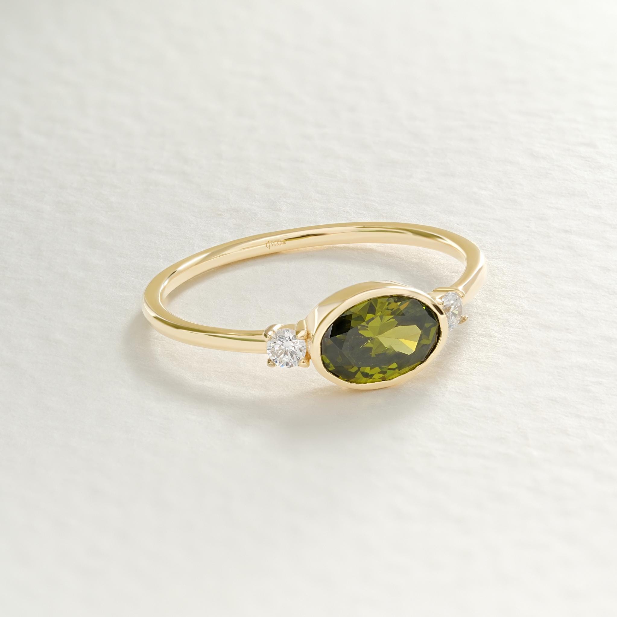 14K Gold Peridot Ring – Oval Green Birthstone Wedding Band 💚✨

Celebrate summer love and timeless beauty with this handcrafted gold peridot ring, featuring a bezel-set oval birthstone ring and sparkling side diamonds. Whether worn as a green wedding ring, anniversary gift, or summer engagement piece, this elegant design radiates grace and color.