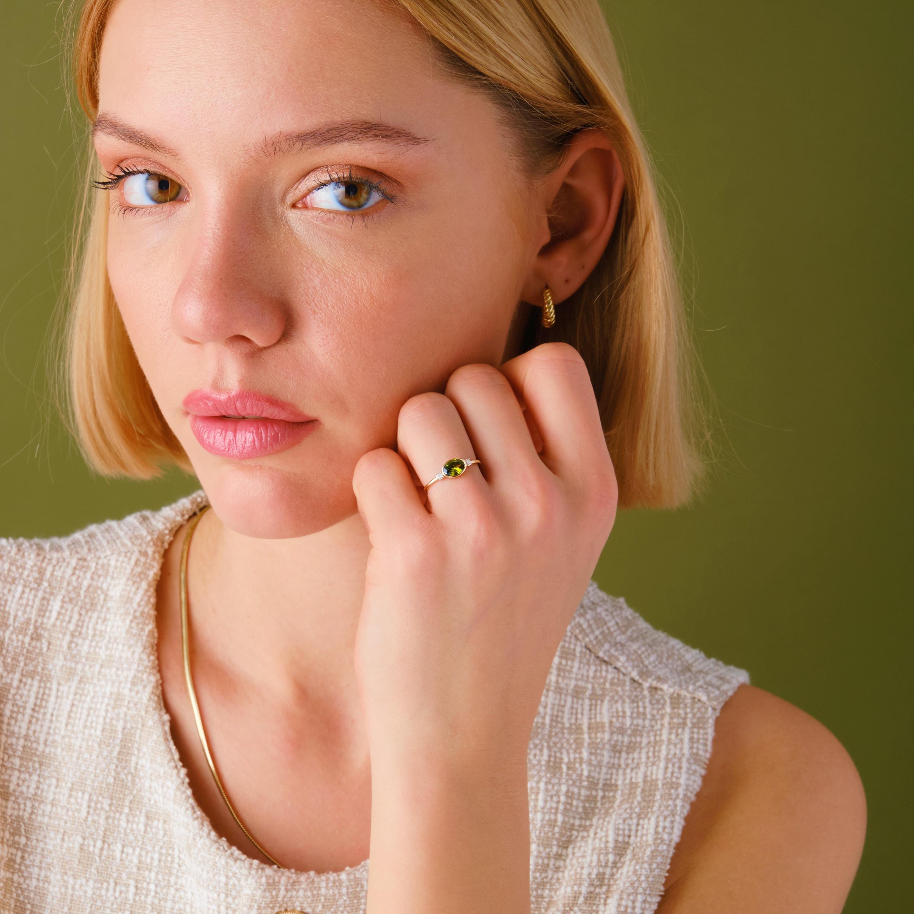 14K Gold Peridot Ring – Oval Green Birthstone Wedding Band 💚✨

Celebrate summer love and timeless beauty with this handcrafted gold peridot ring, featuring a bezel-set oval birthstone ring and sparkling side diamonds. Whether worn as a green wedding ring, anniversary gift, or summer engagement piece, this elegant design radiates grace and color.